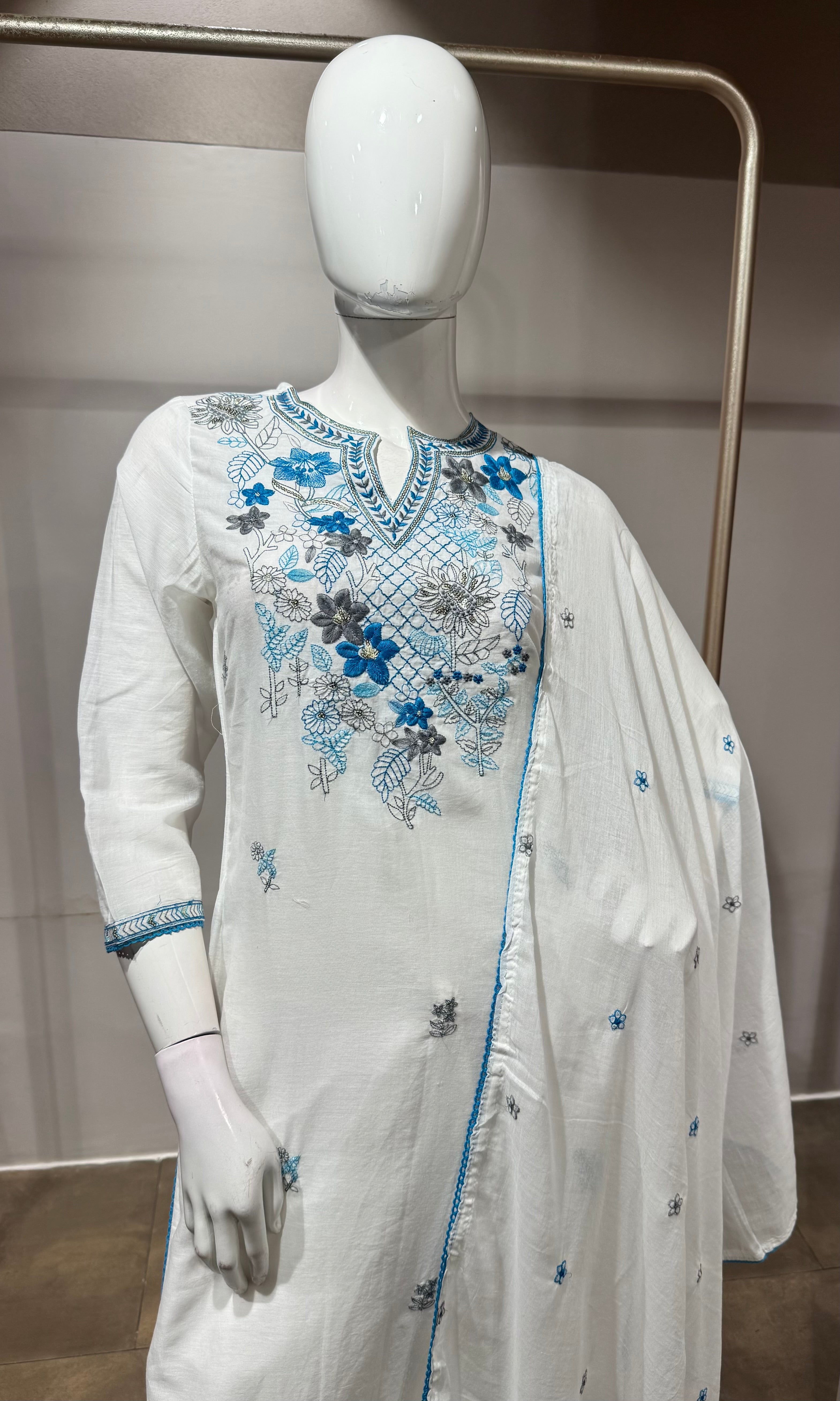 white kurta set features blue floral embroidery