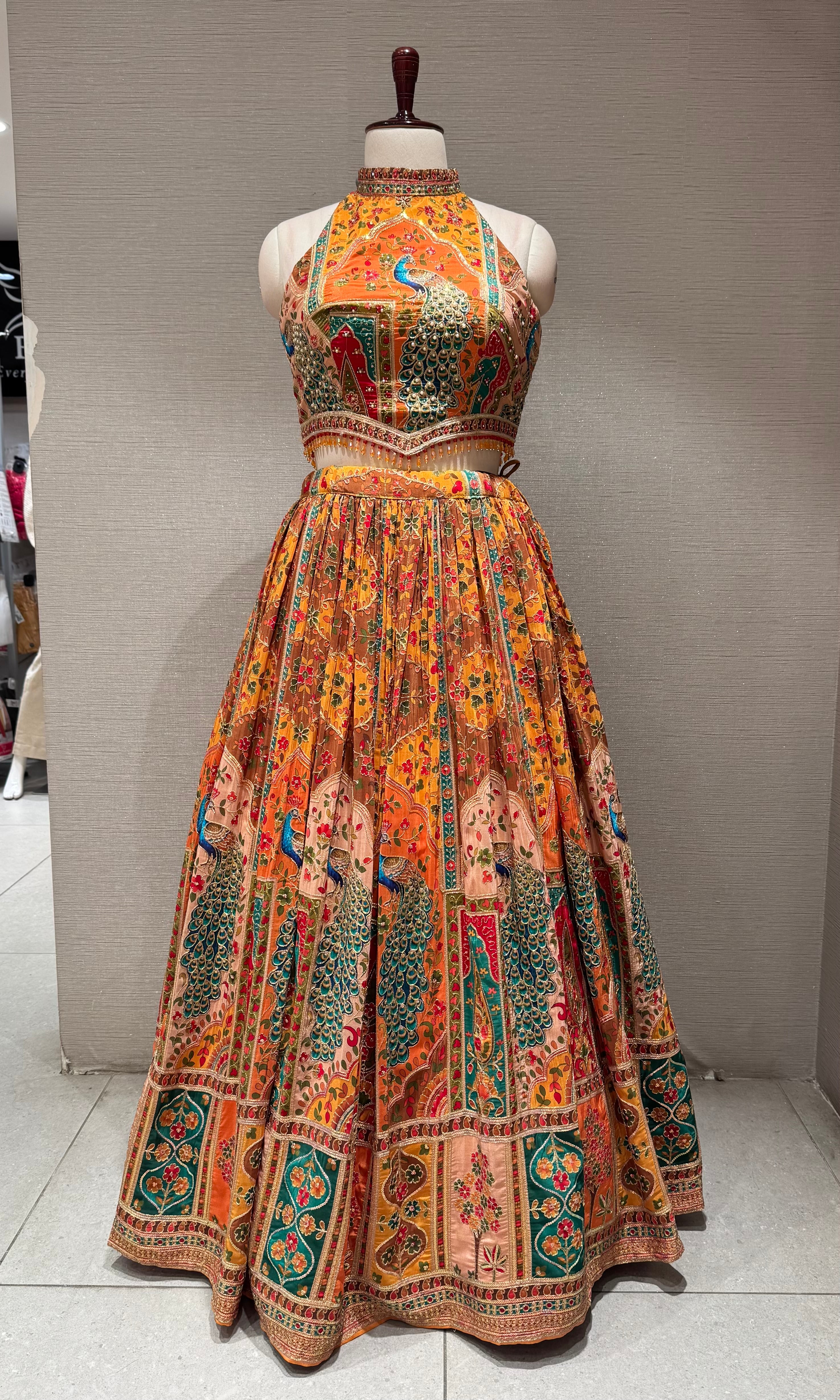 Mustard Mayur Pichwai halter neck Lehenga set
