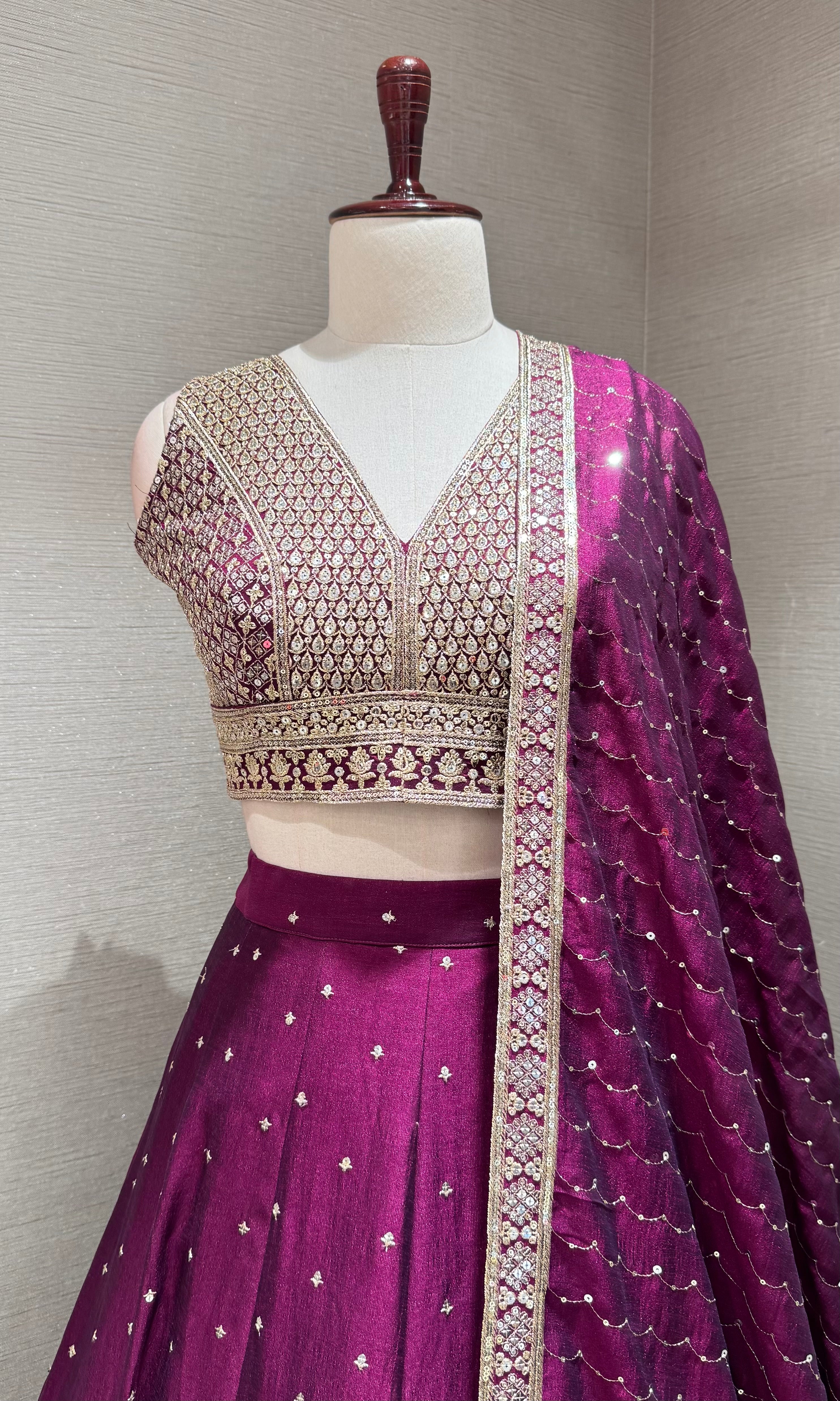 Wine and gold embroidered Lehenga Choli