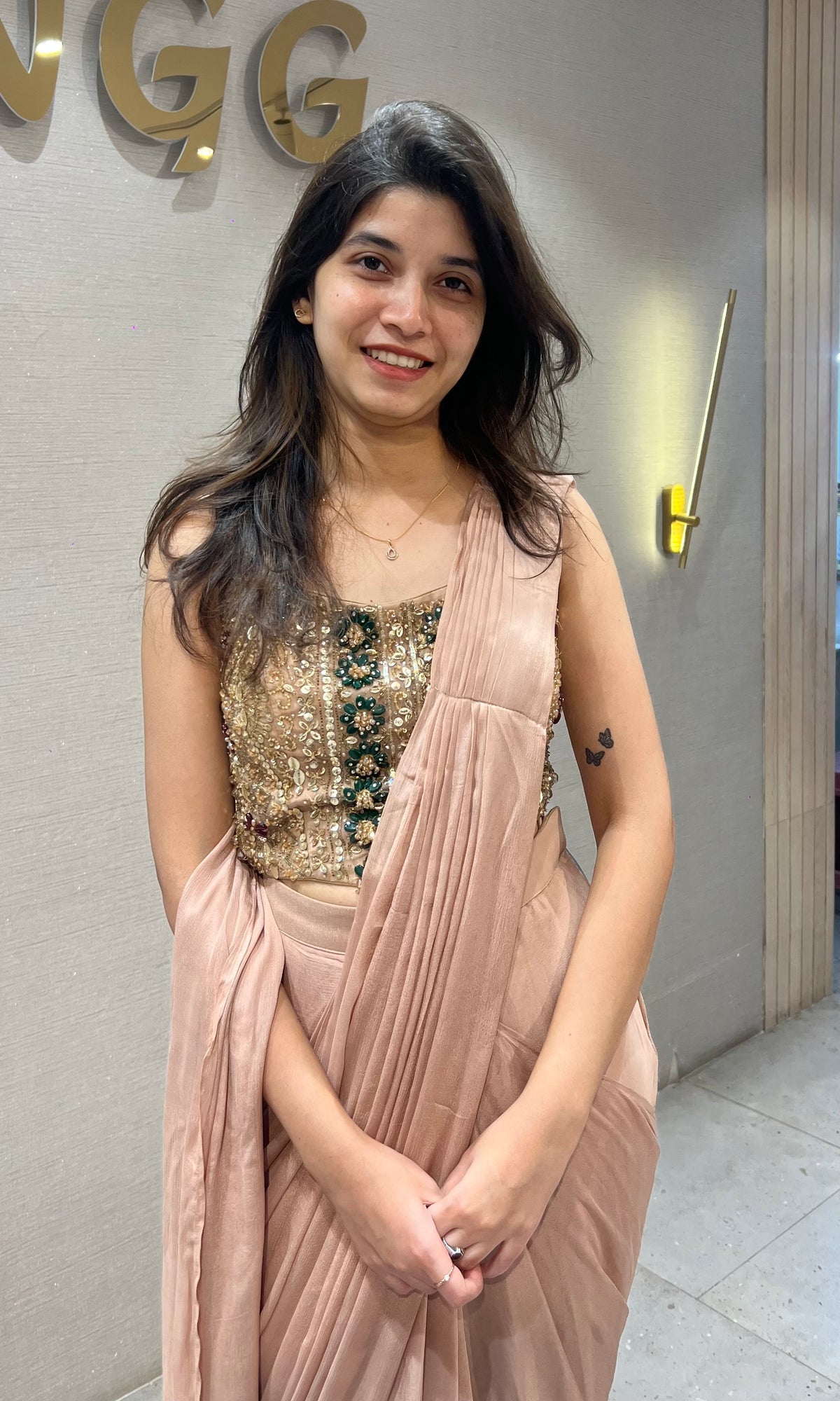 Dusty Georgette drape saree with gold & emerald green detailing blouse