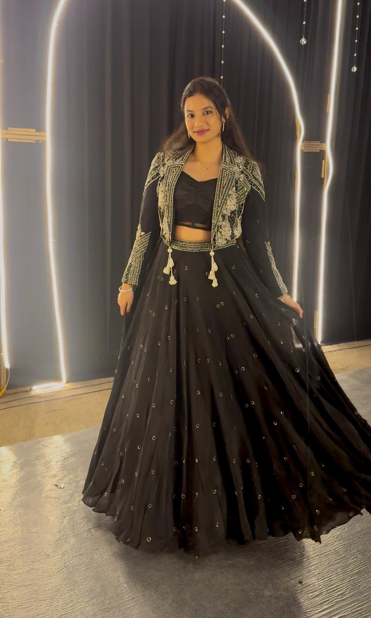 Black lehenga with corset blouse and jacket