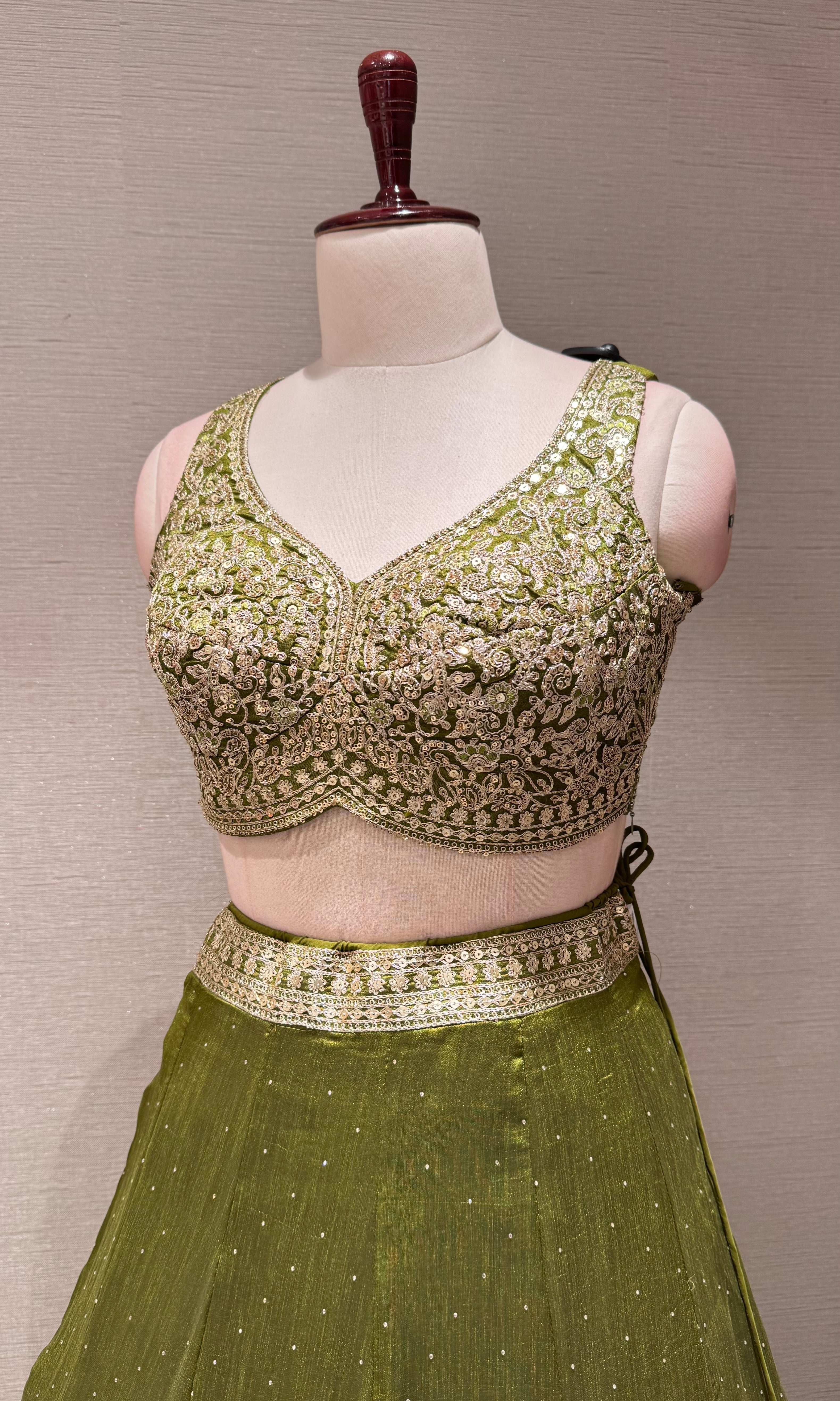 Green Lehenga Choli with Intricate Gold Embroidery