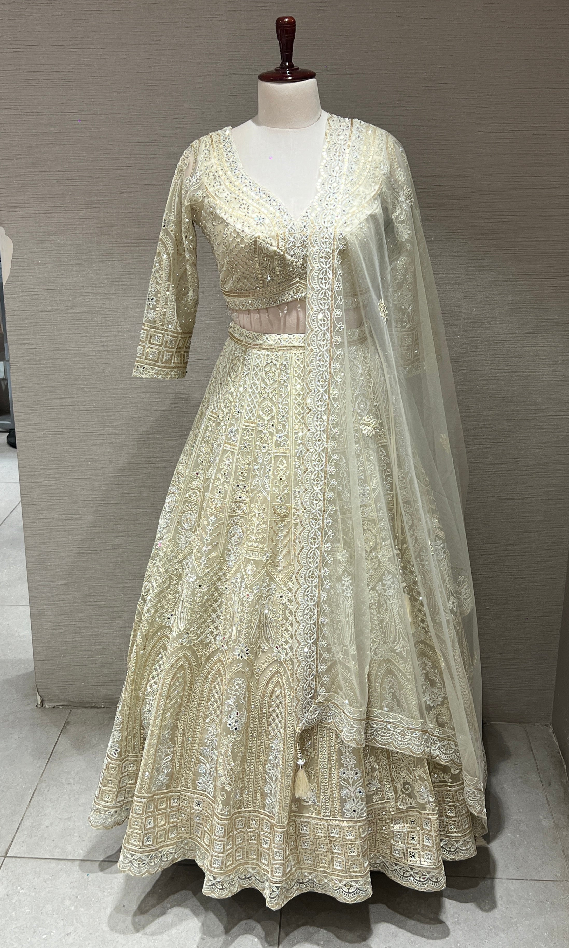 Half white ZARDOZI EMBROIDERED LEHENGA