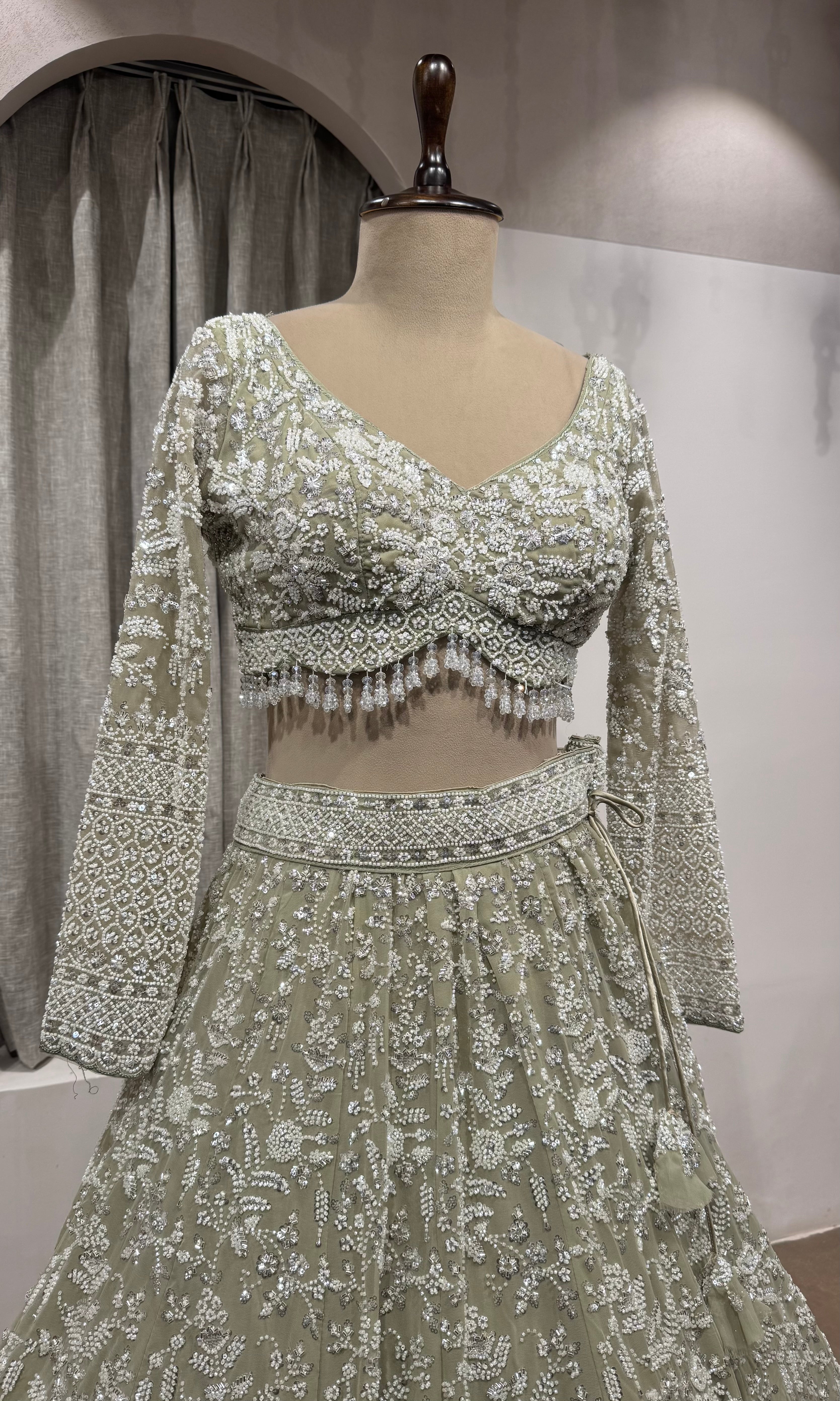 Sage Green Heavily Embroidered Net Bridal Lehenga