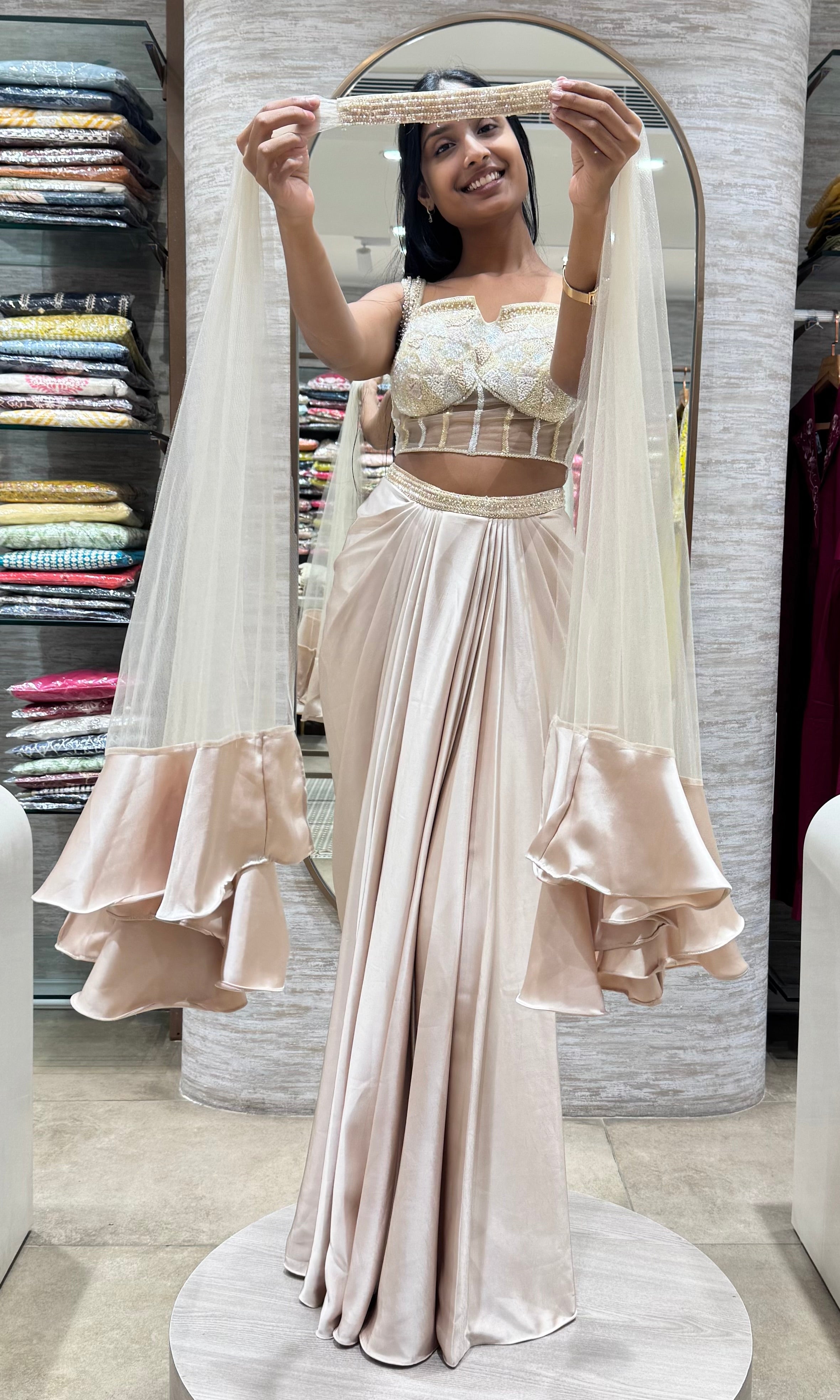 half white drape saree with corset blouse and cape