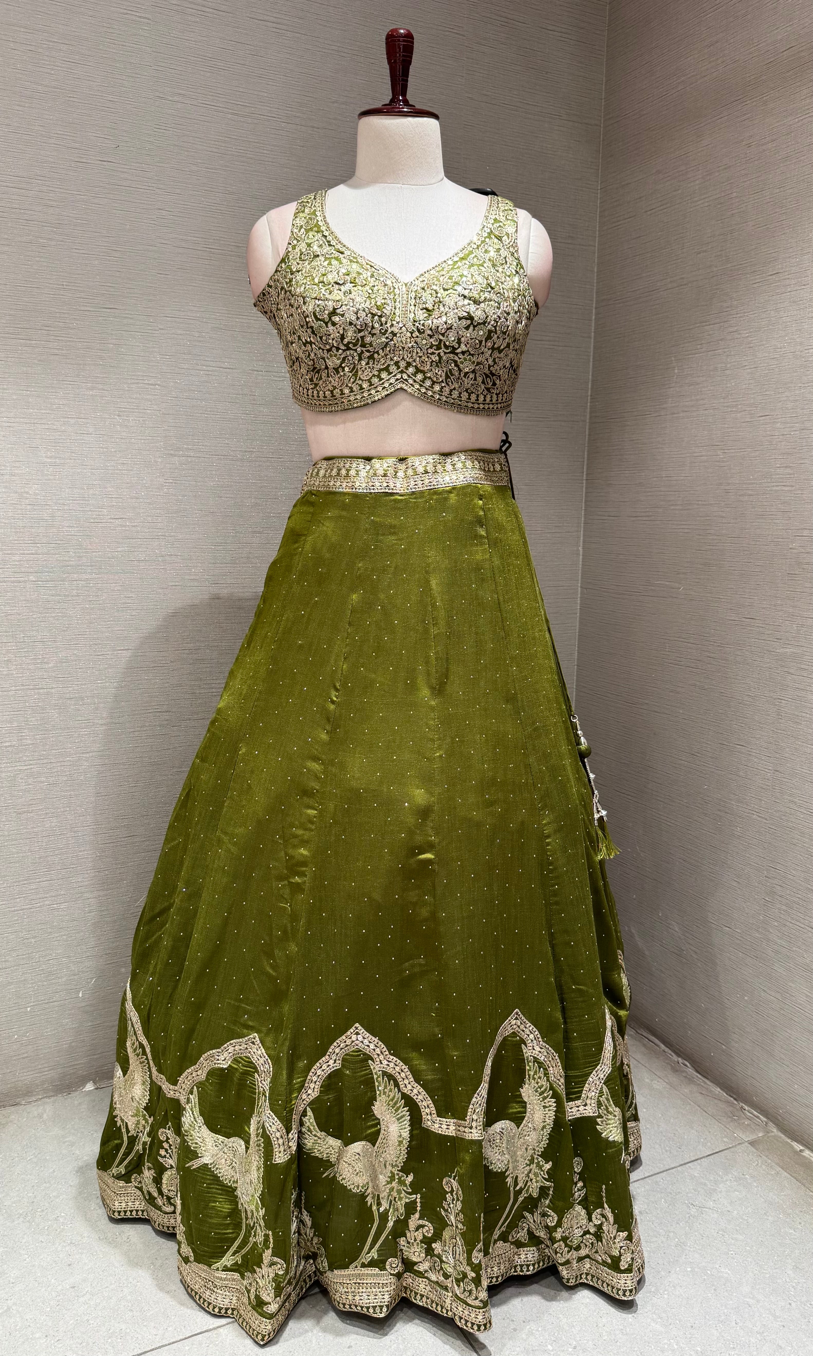 Green Lehenga Choli with Intricate Gold Embroidery