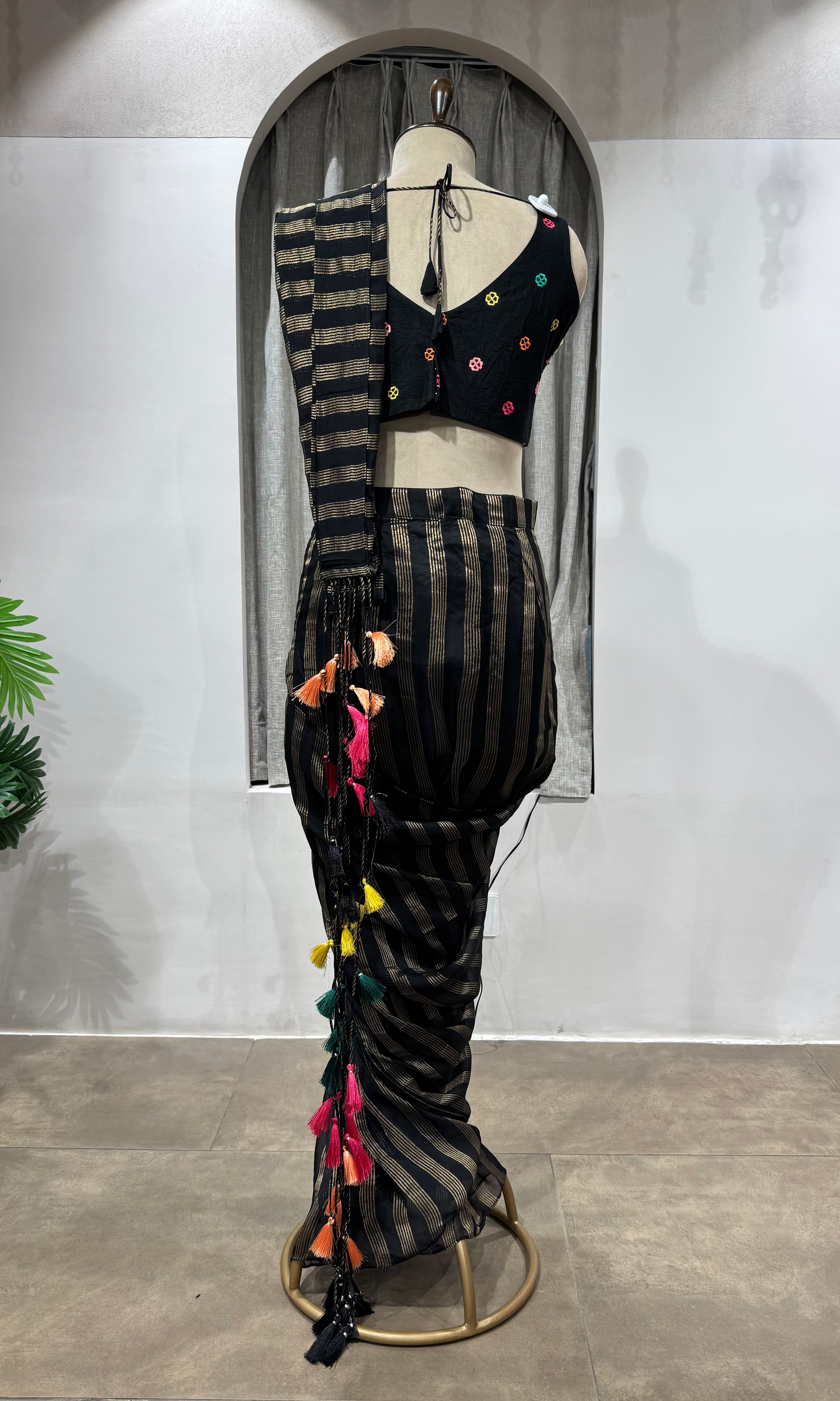 Black and silver striped drape saree with intricate blouse