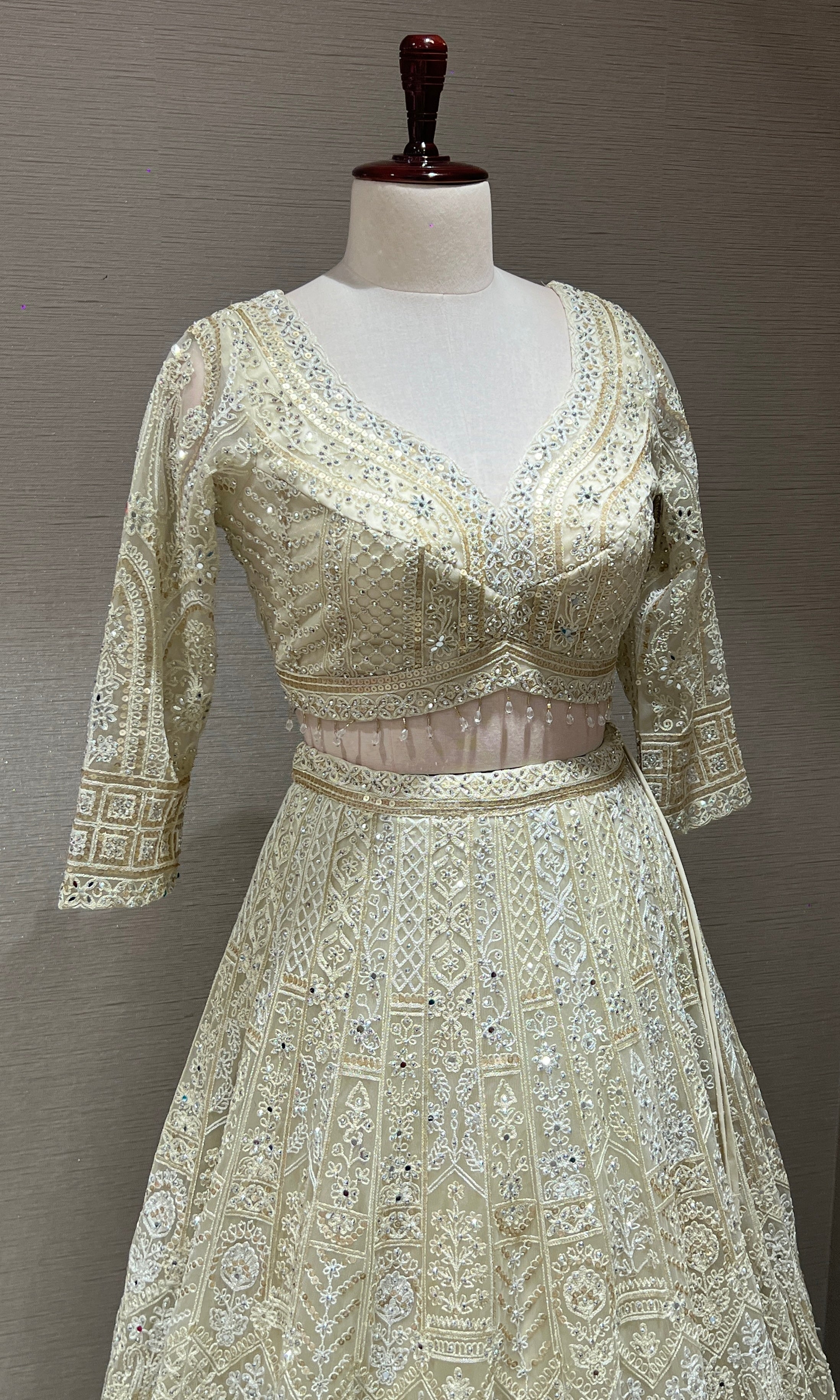 Half white ZARDOZI EMBROIDERED LEHENGA