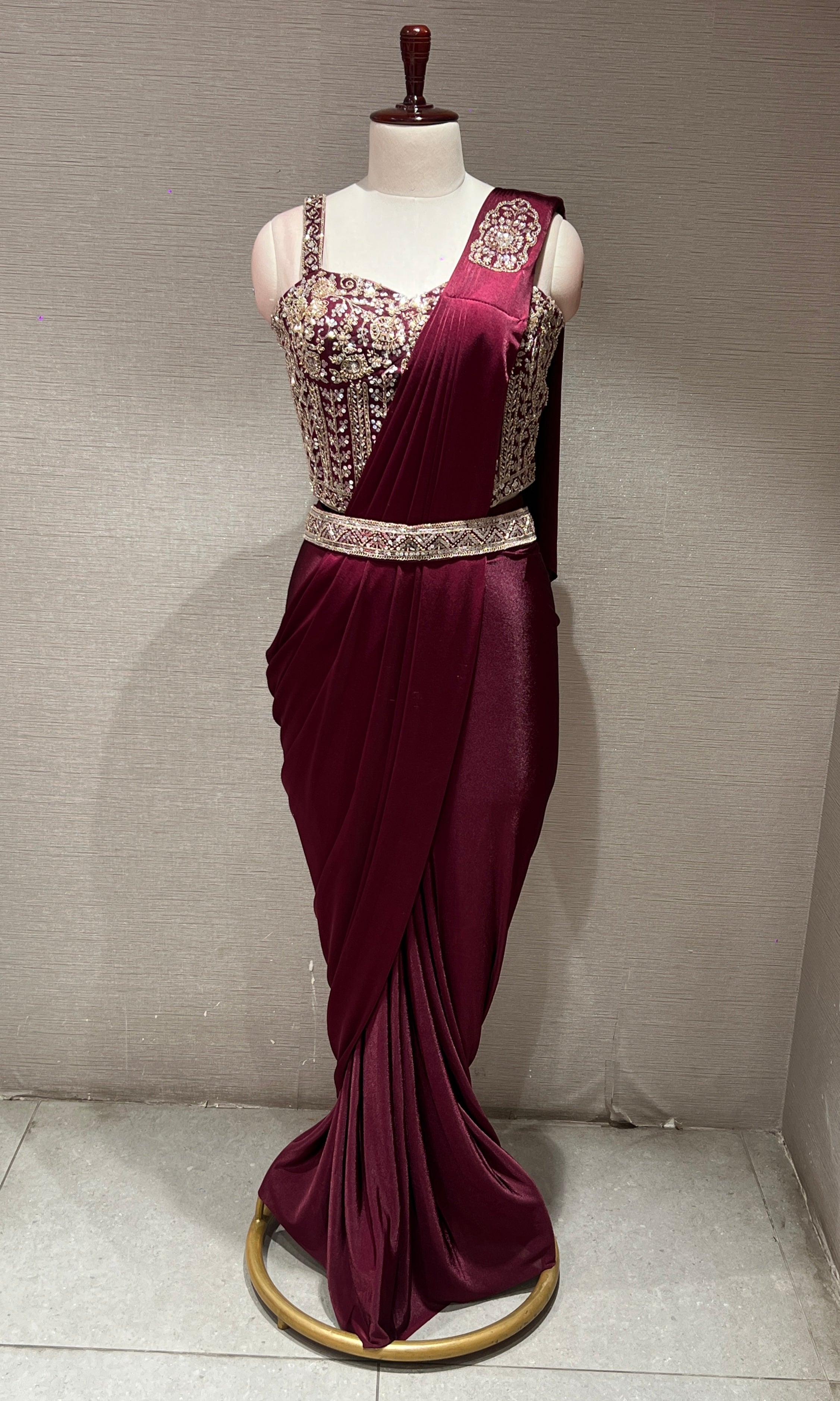 wine drape saree with corset blouse and belt