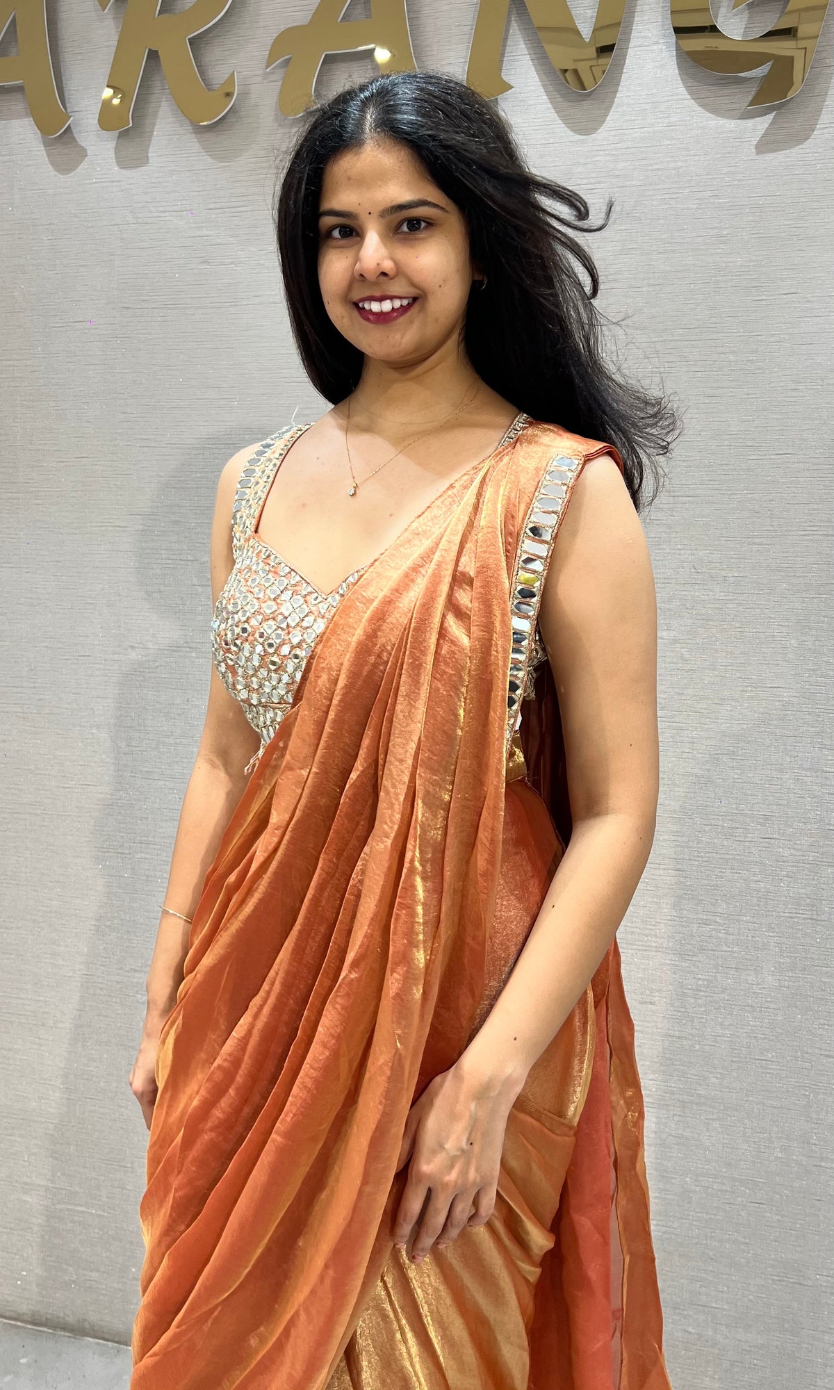 Rust Shimmer Drape Saree with mirror embellished blouse