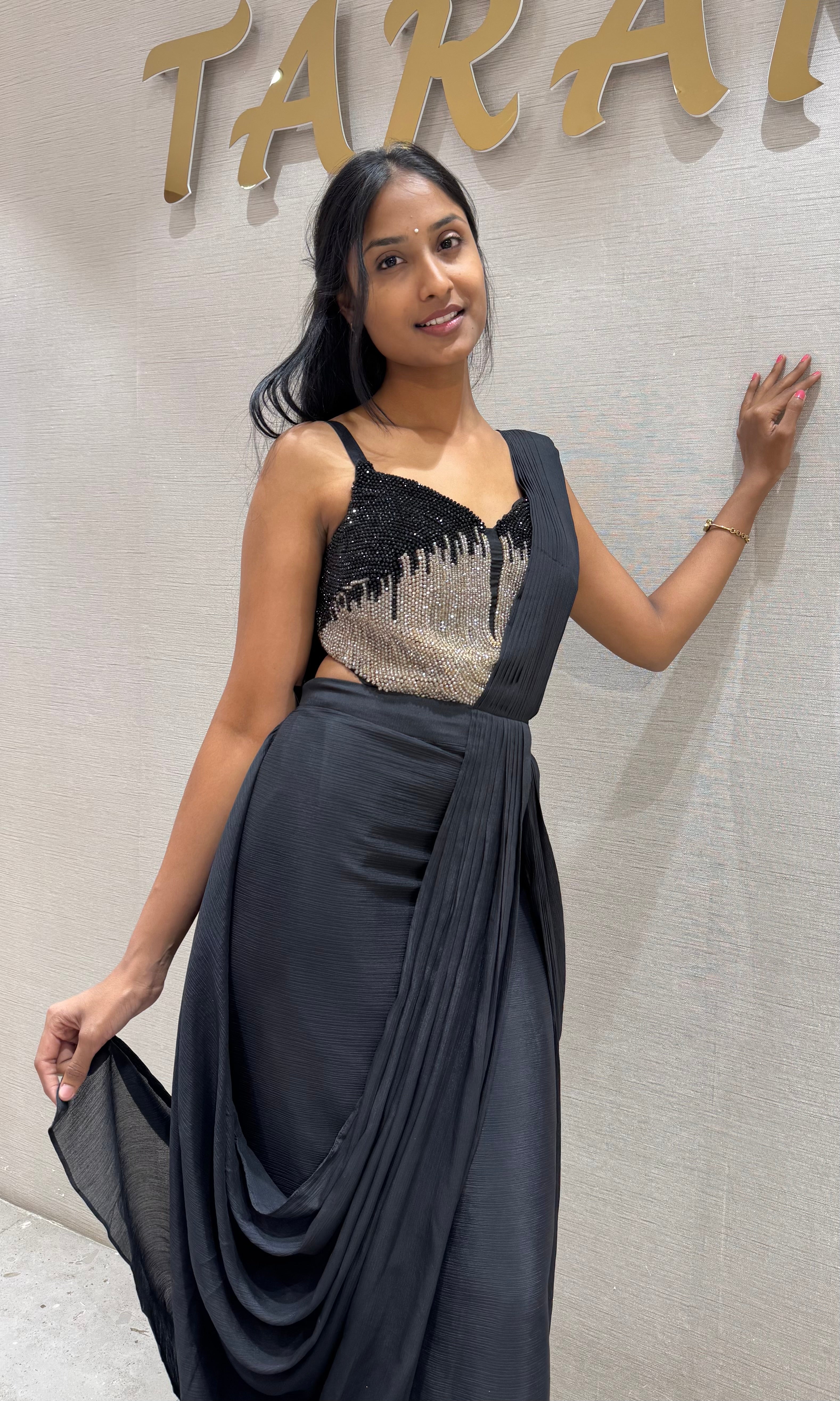 black draped saree with sequined corset blouse
