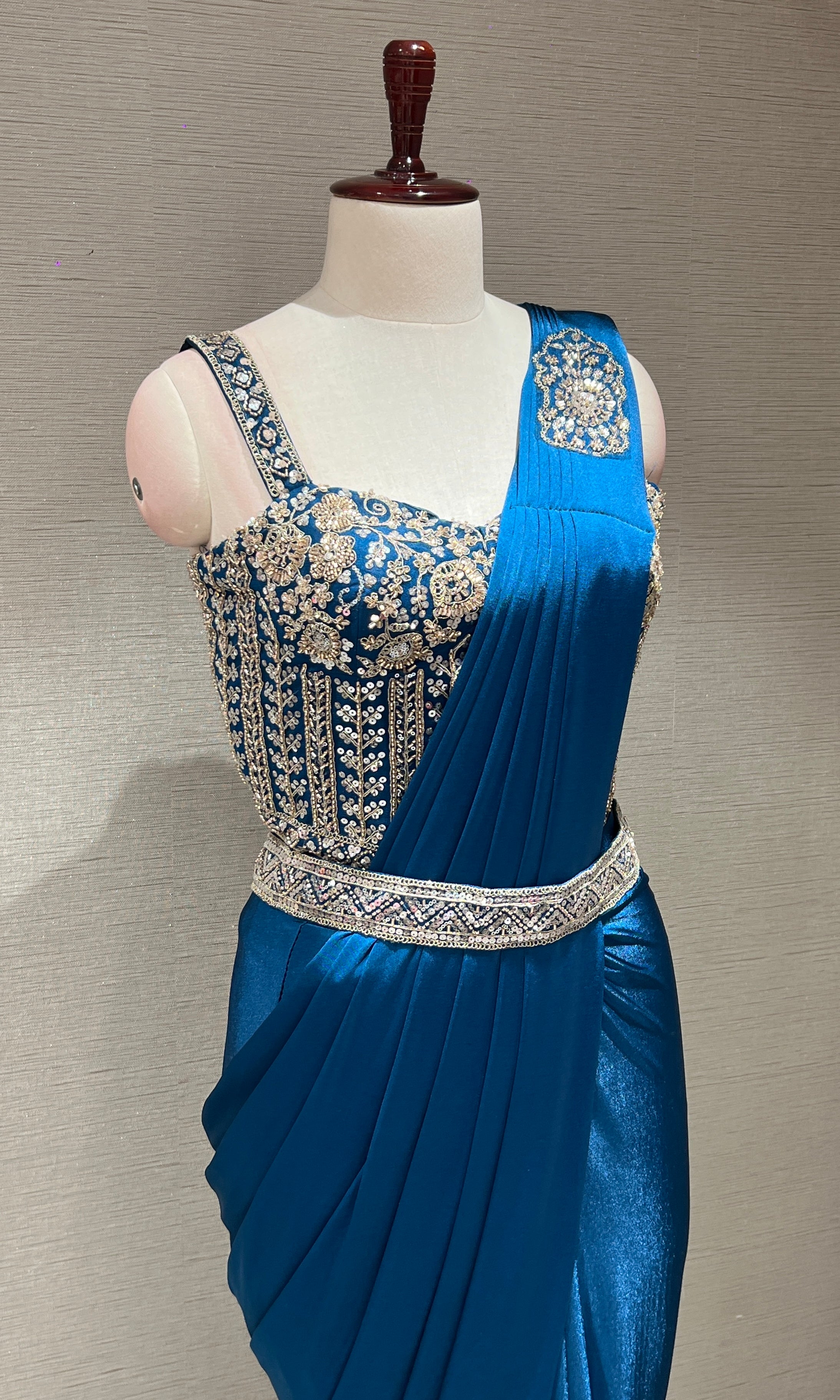 blue drape saree with corset blouse and belt