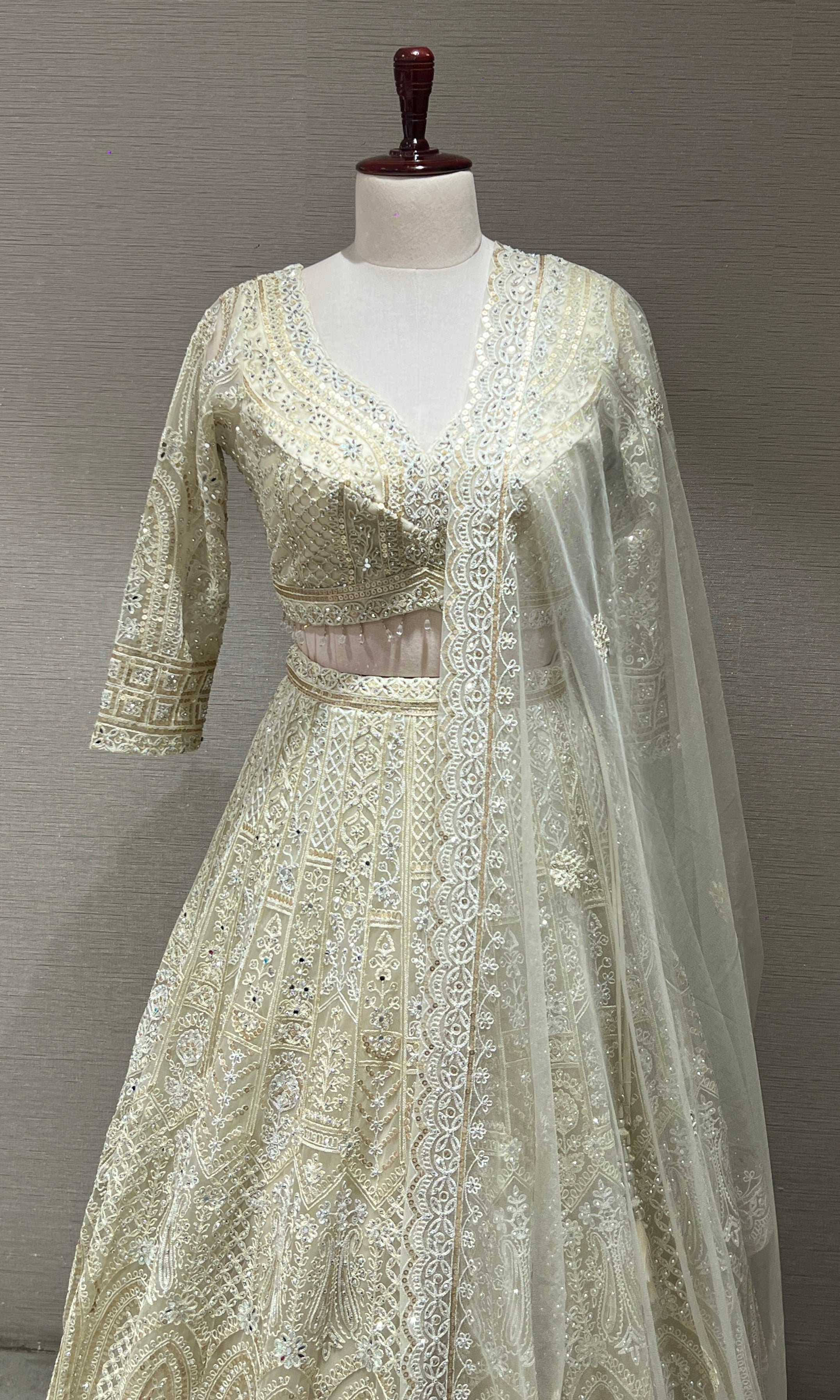 Half white ZARDOZI EMBROIDERED LEHENGA
