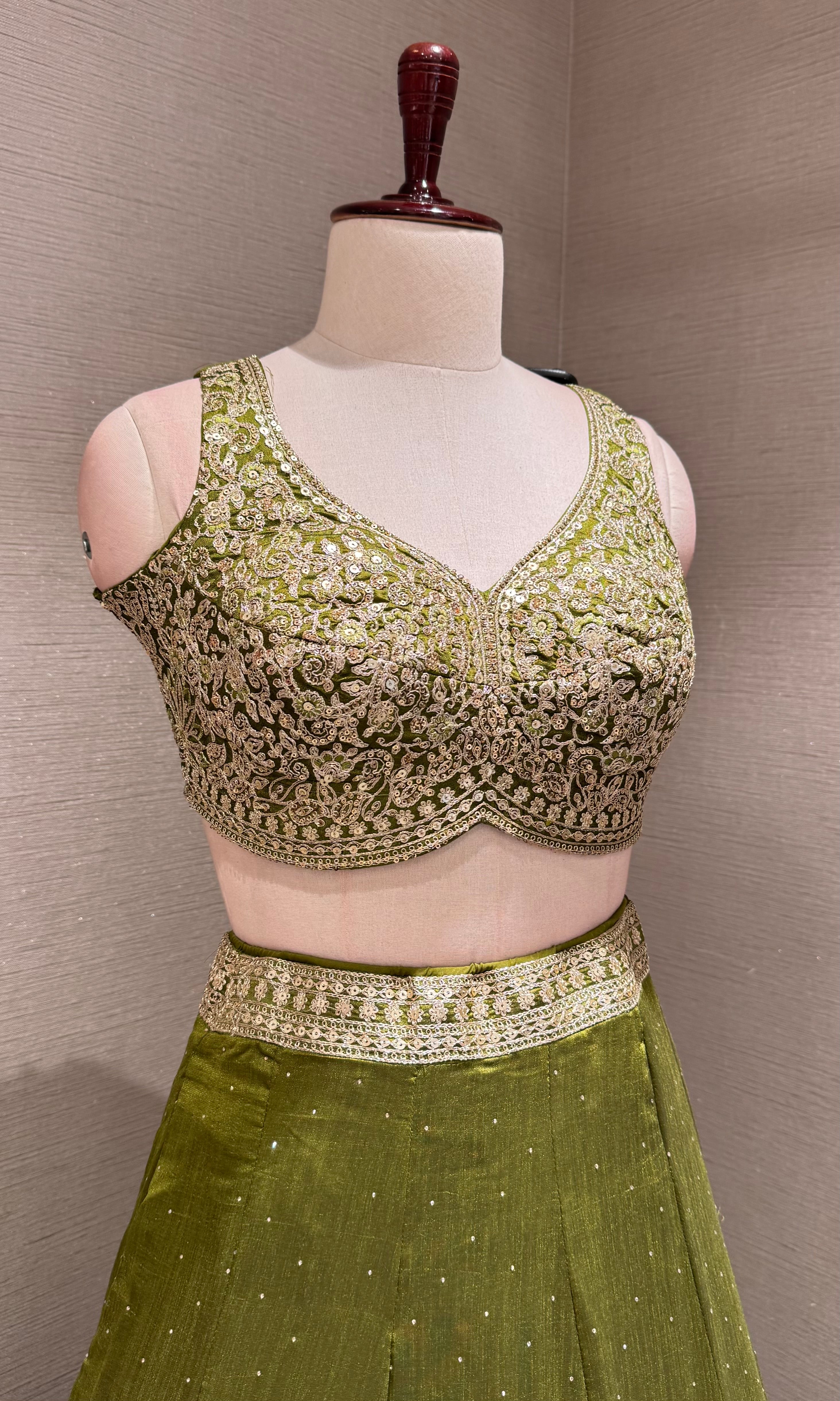 Green Lehenga Choli with Intricate Gold Embroidery