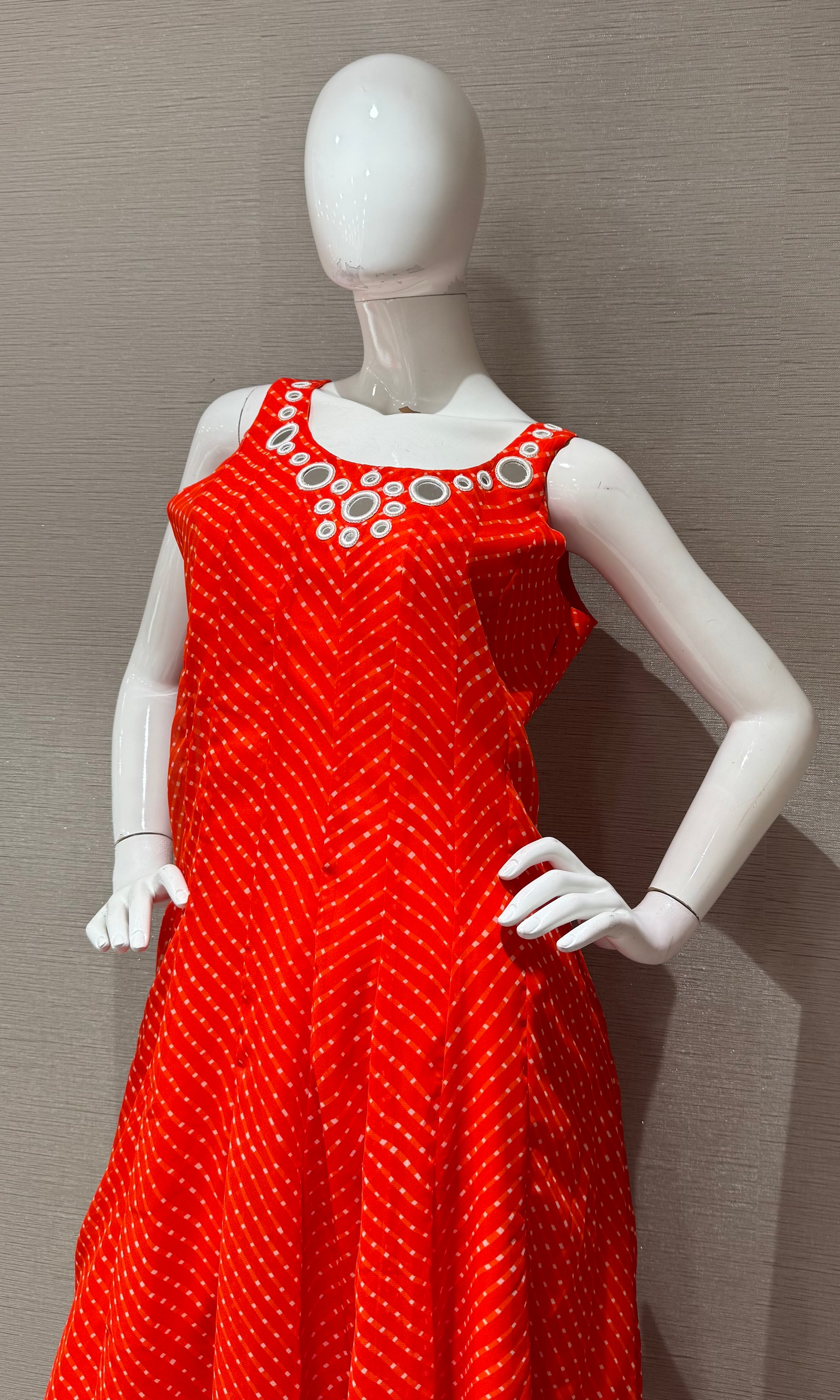 Orange bandhani print and intricate mirror anarkali set
