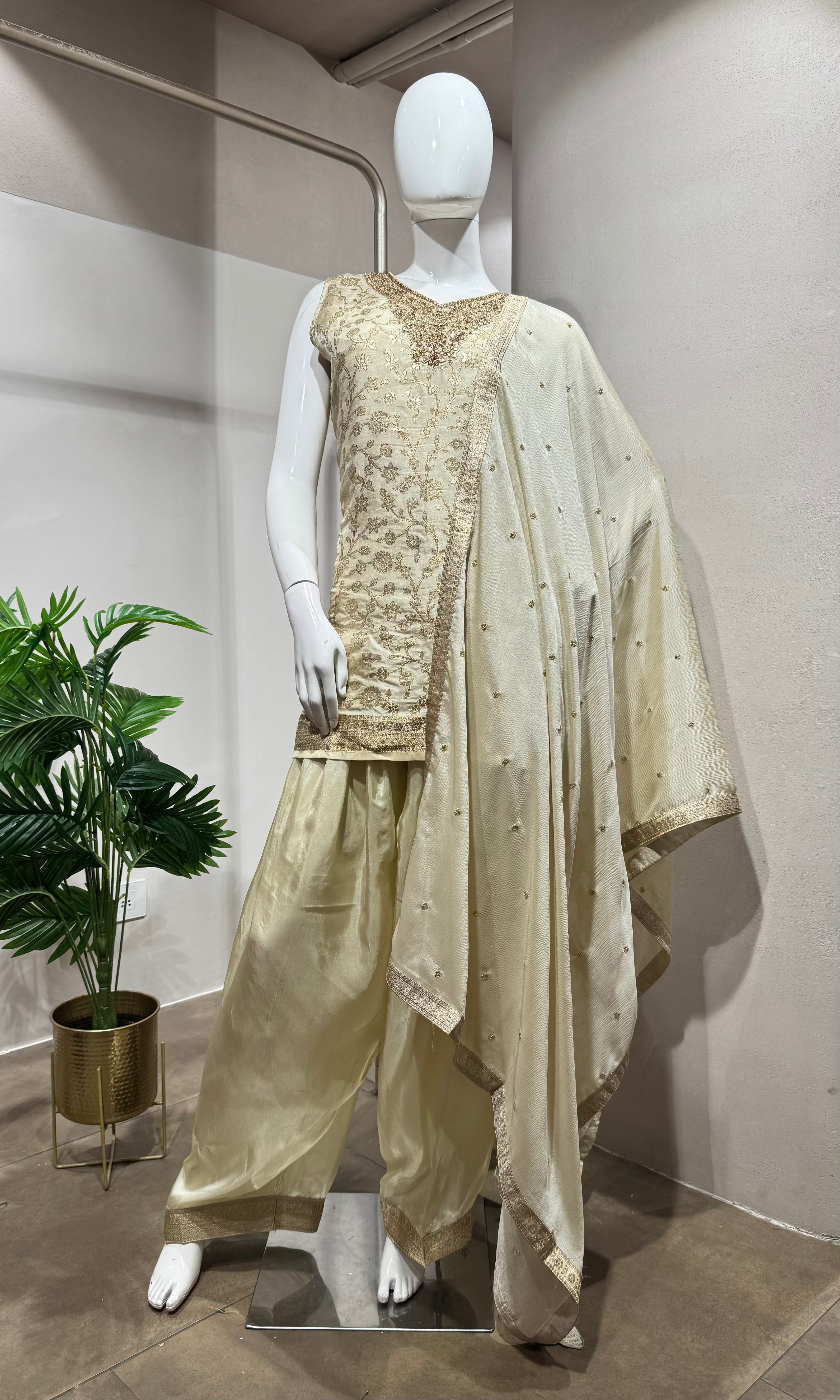 half white kurta set with pants and a dupatta