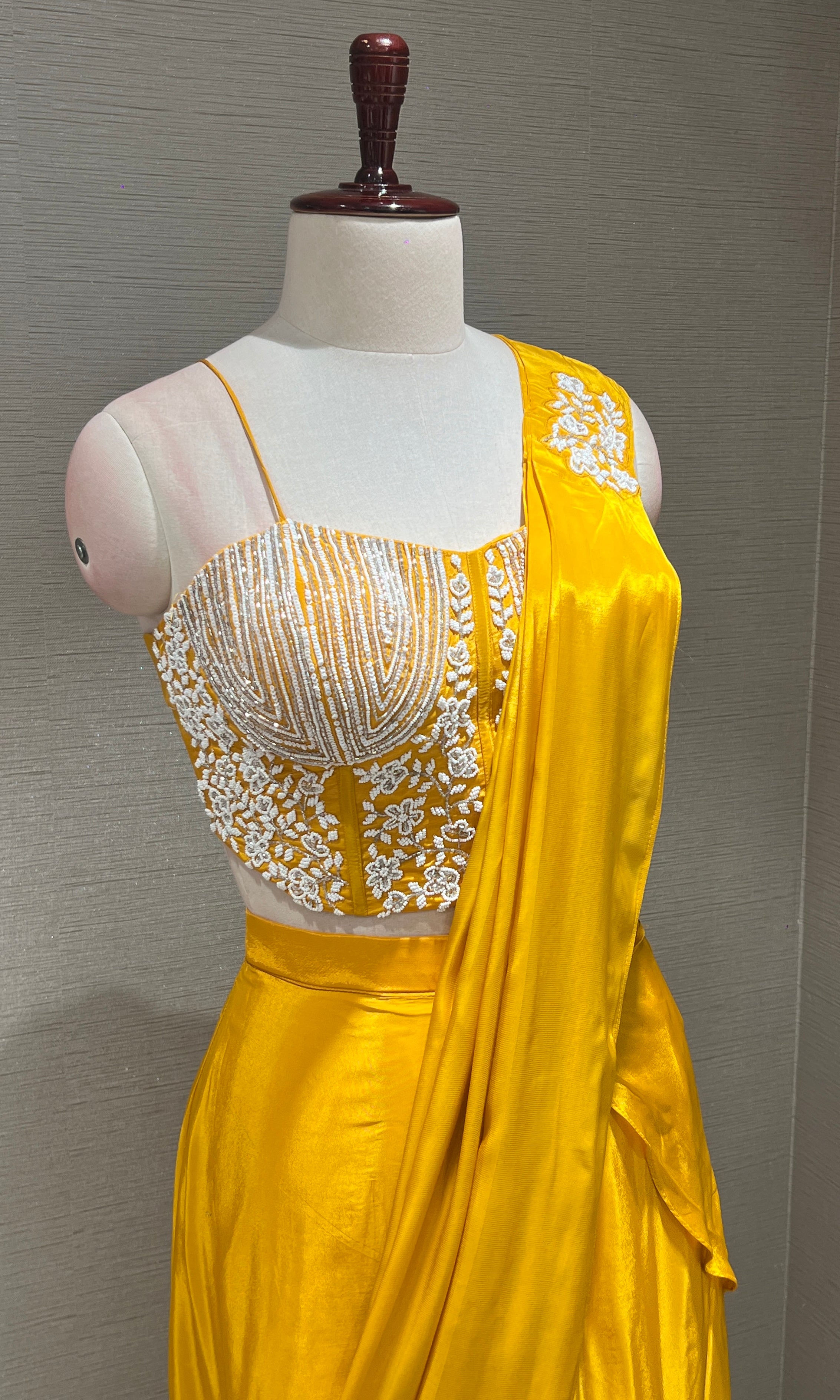 Yellow drape saree with Corset blouse