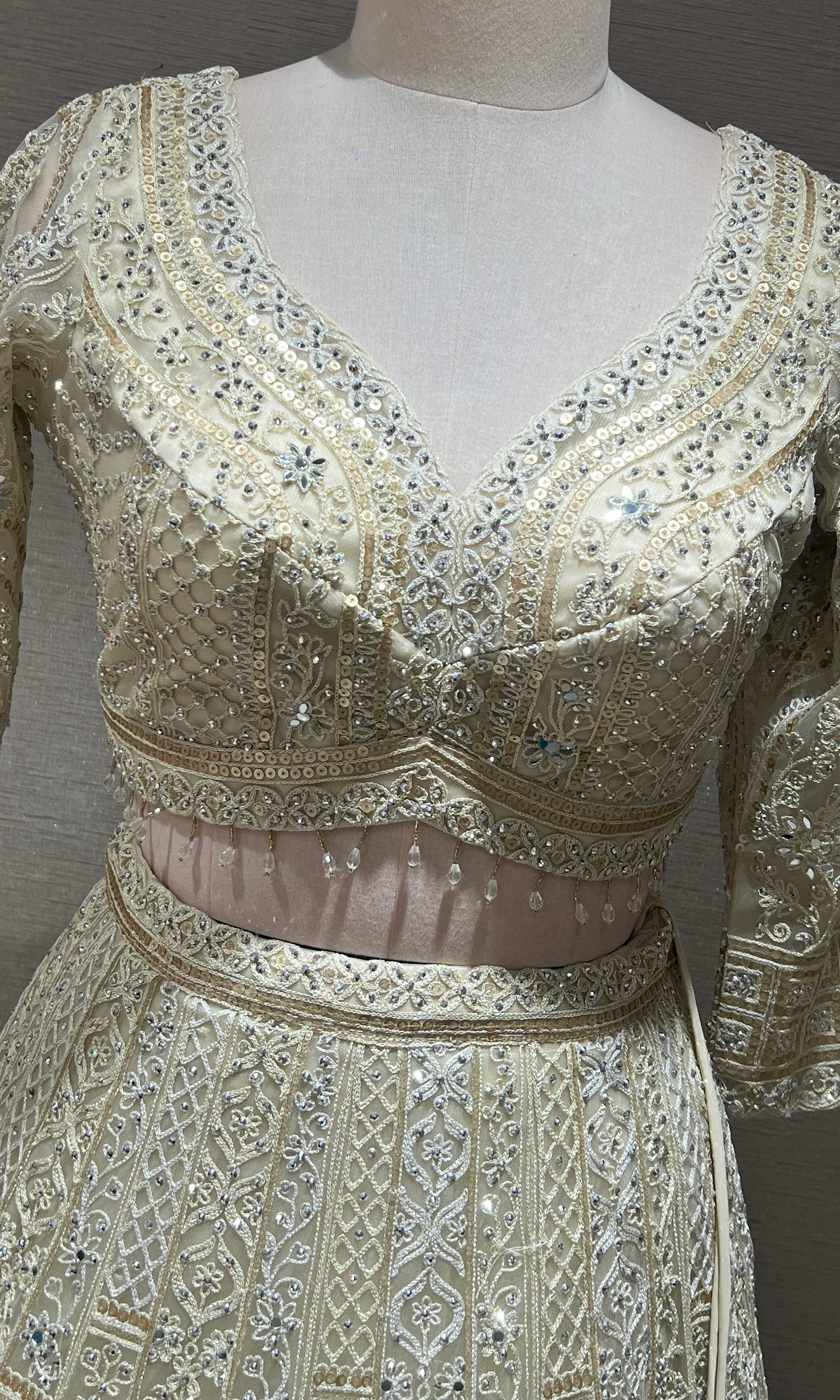 Half white ZARDOZI EMBROIDERED LEHENGA