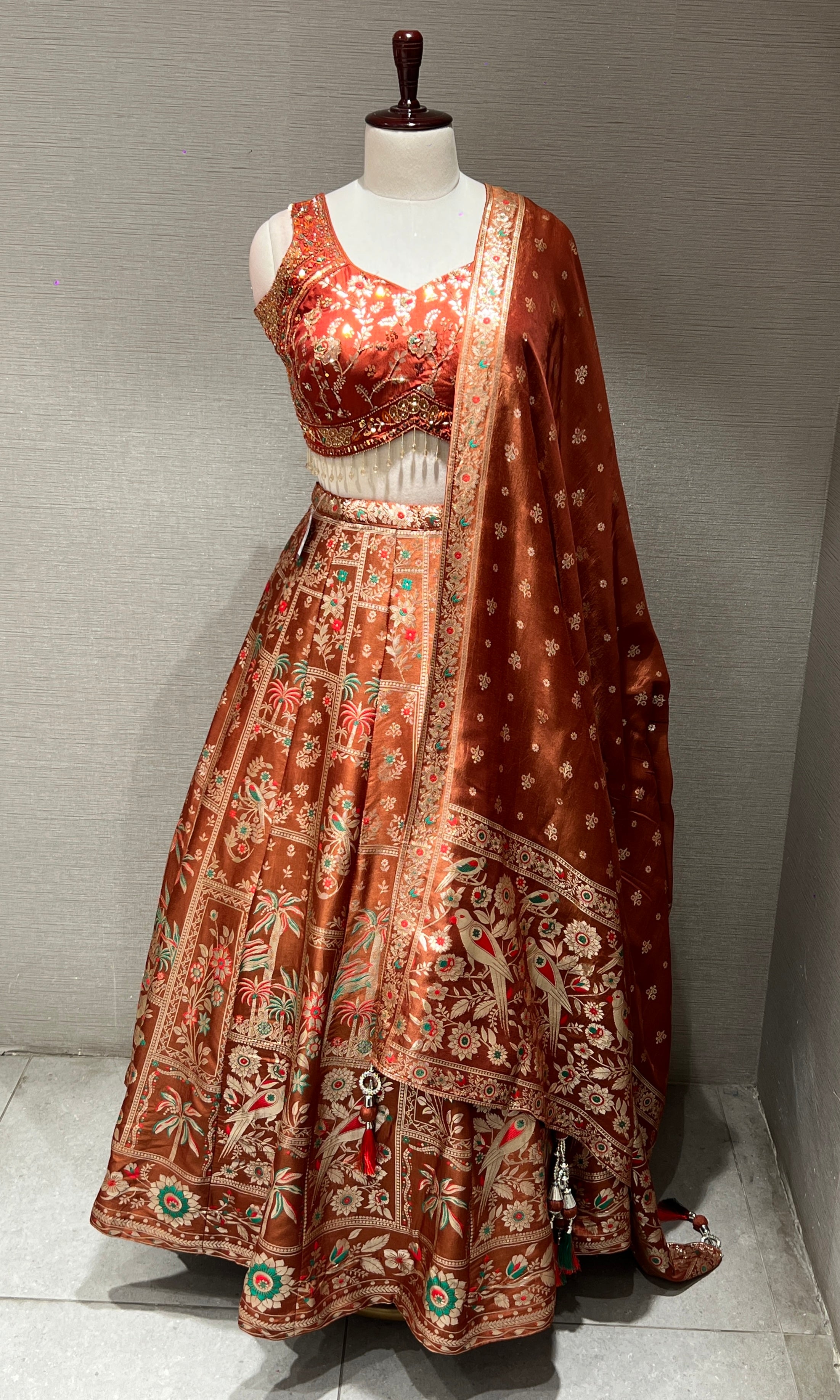 Rust orange Lehenga with Floral and Peacock embroidery