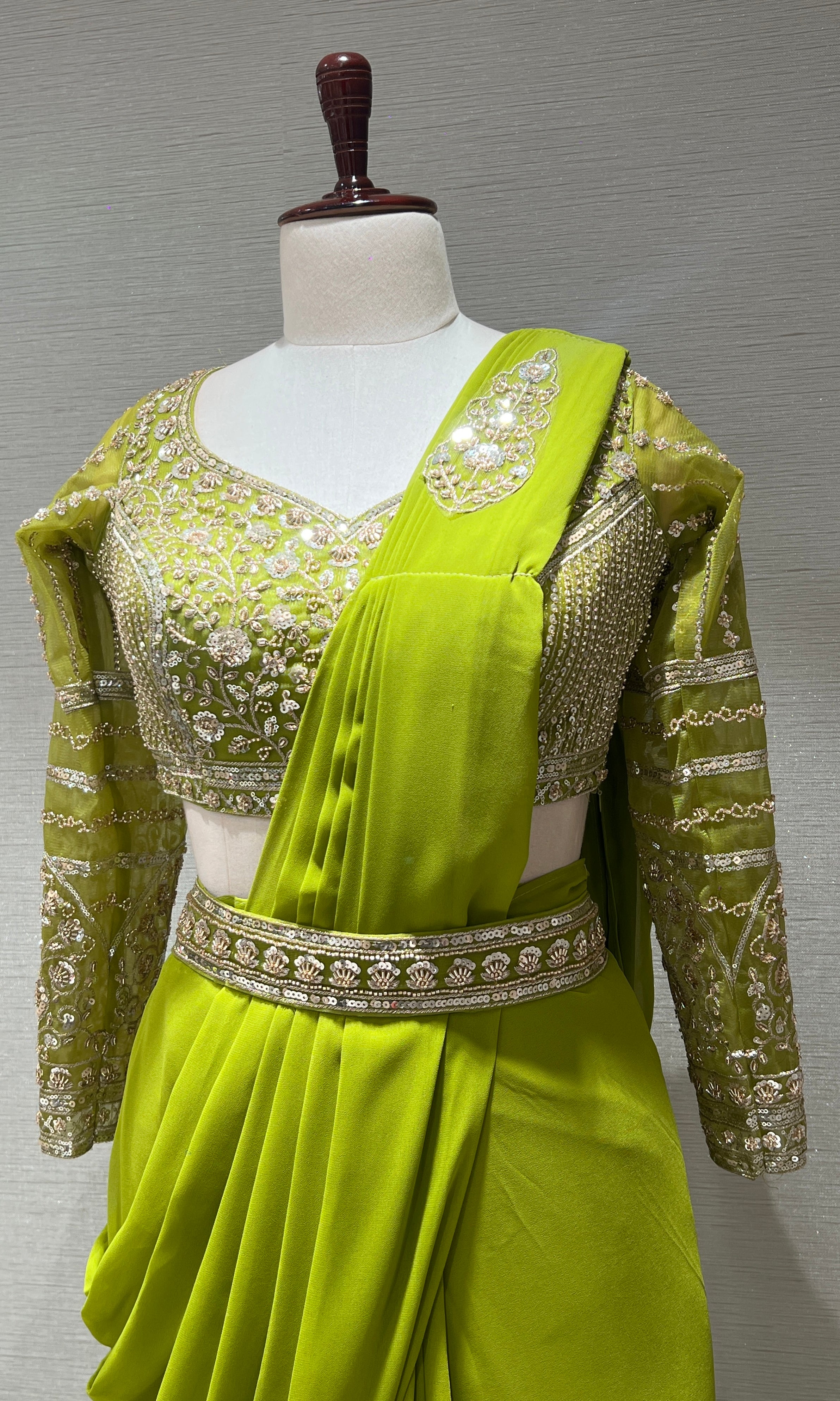 green draped saree with embellished blouse