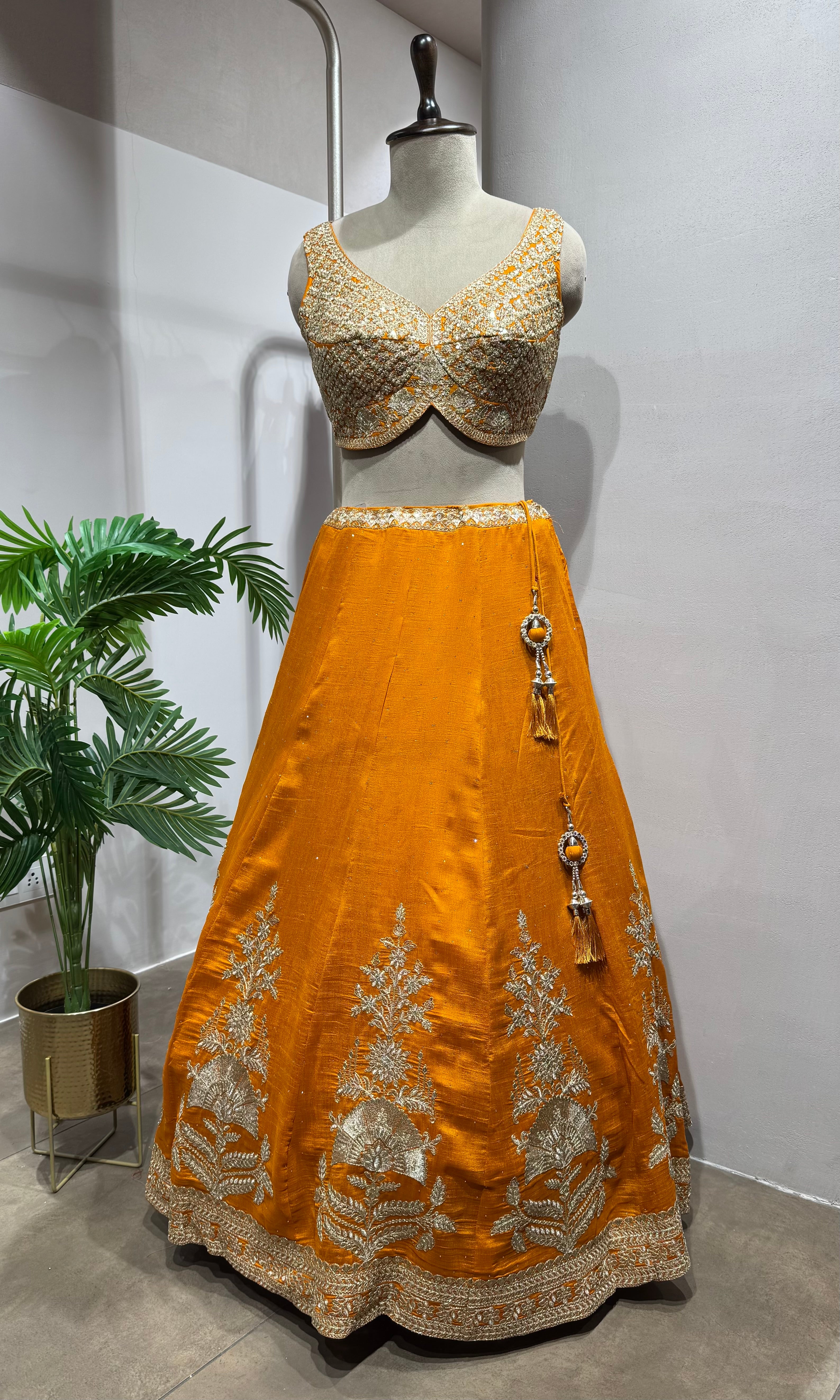 orange silk lehenga set with gold embroidery