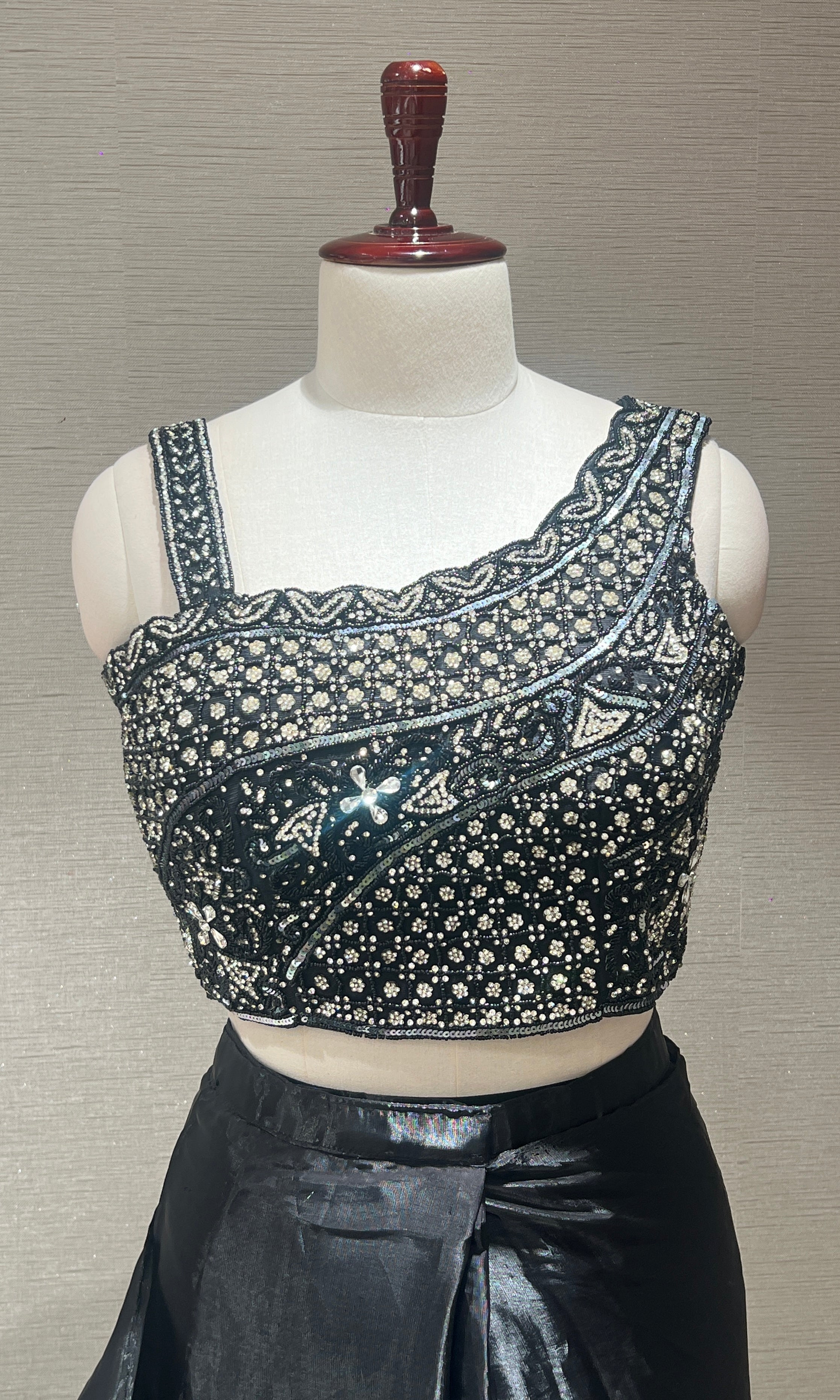 Black ruffle drape saree with embroidered blouse