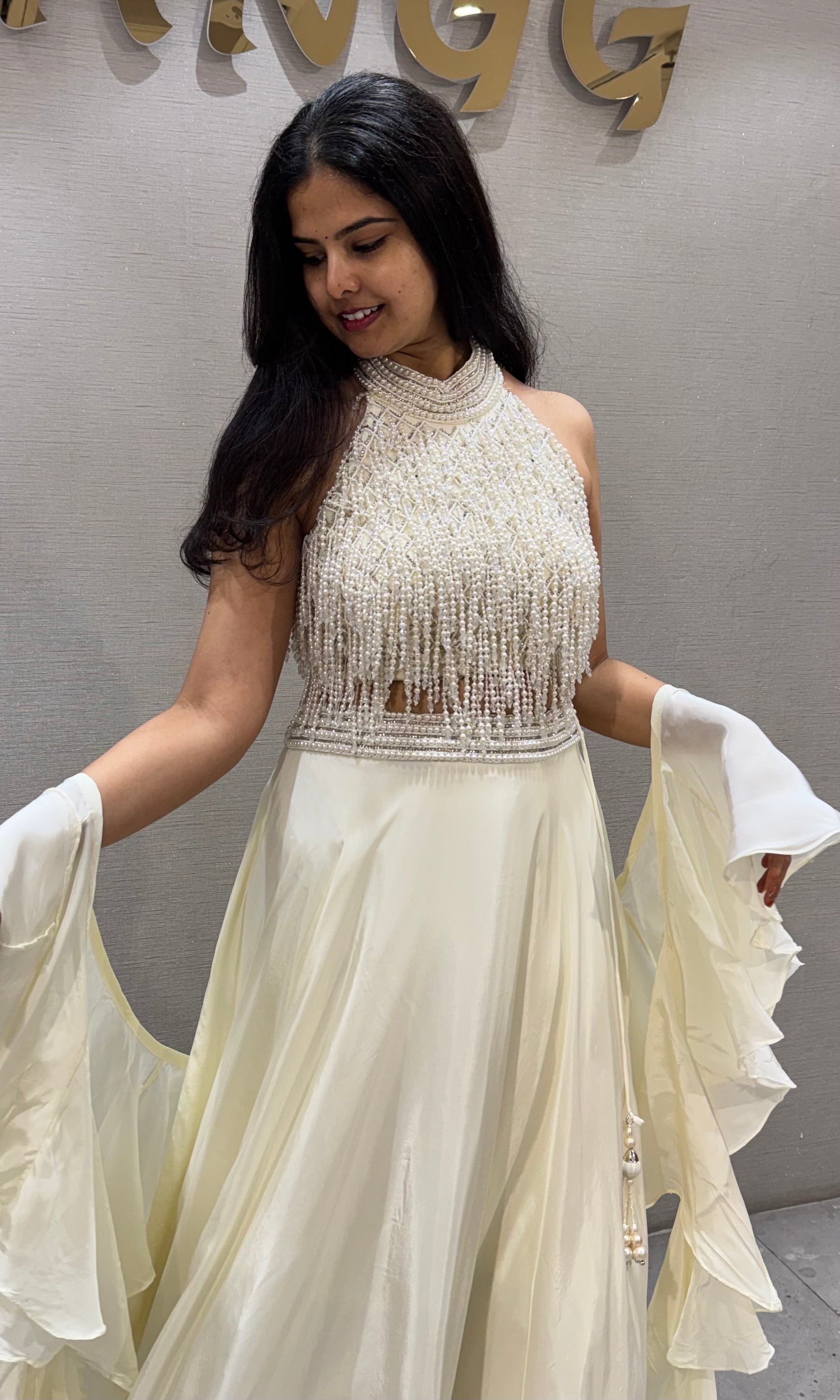 Cream Halter Lehenga with Beaded Fringe Ruffled Sleeves