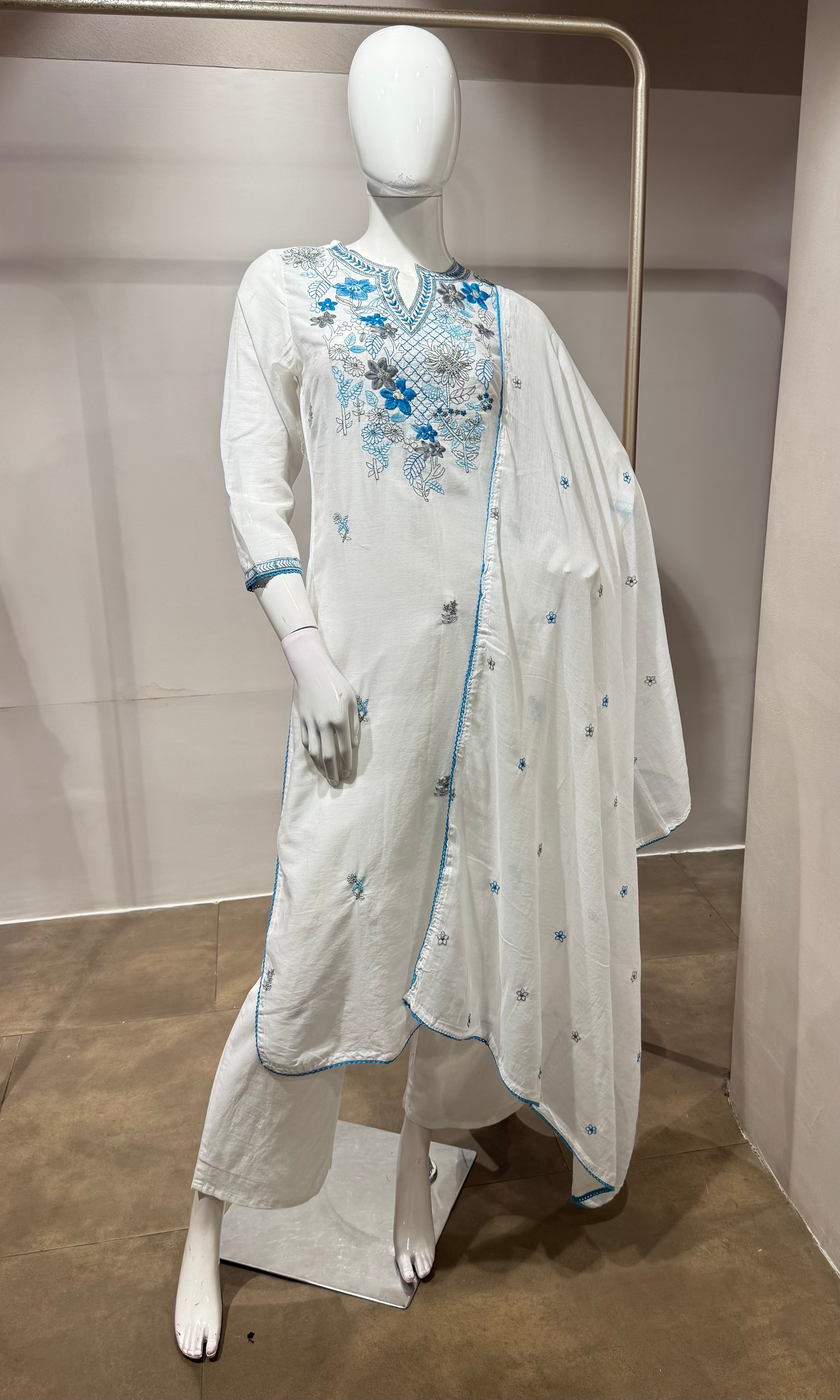 white kurta set features blue floral embroidery