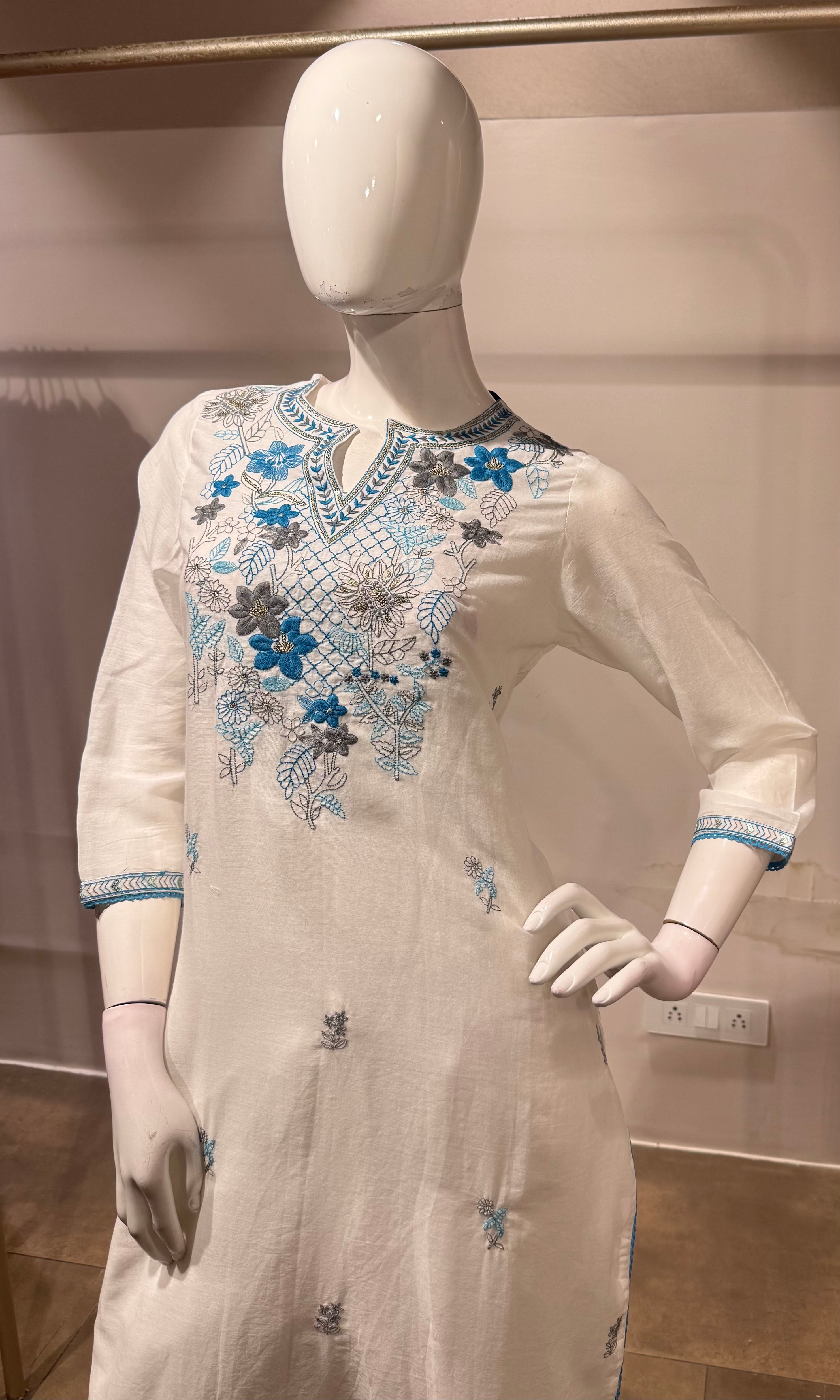 white kurta set features blue floral embroidery