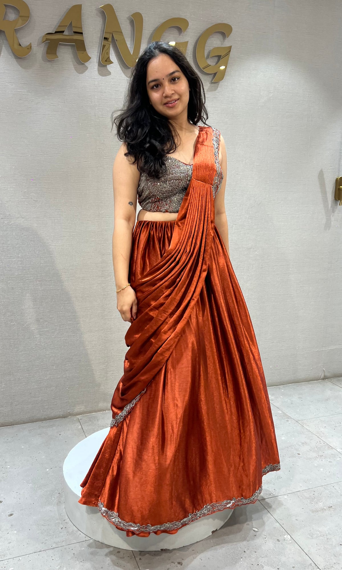 Rust Orange satin Draped lehenga with Silver embroidered Blouse