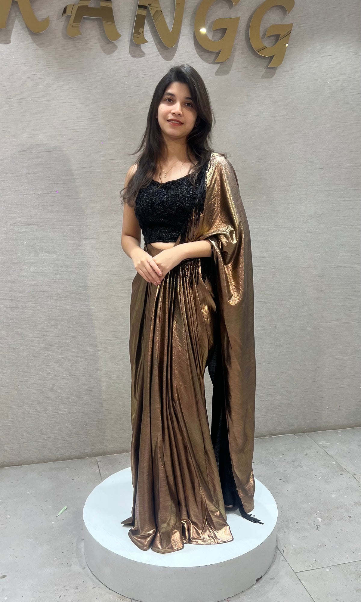 Metallic Brown Pleated Saree with Embroidered Black Blouse
