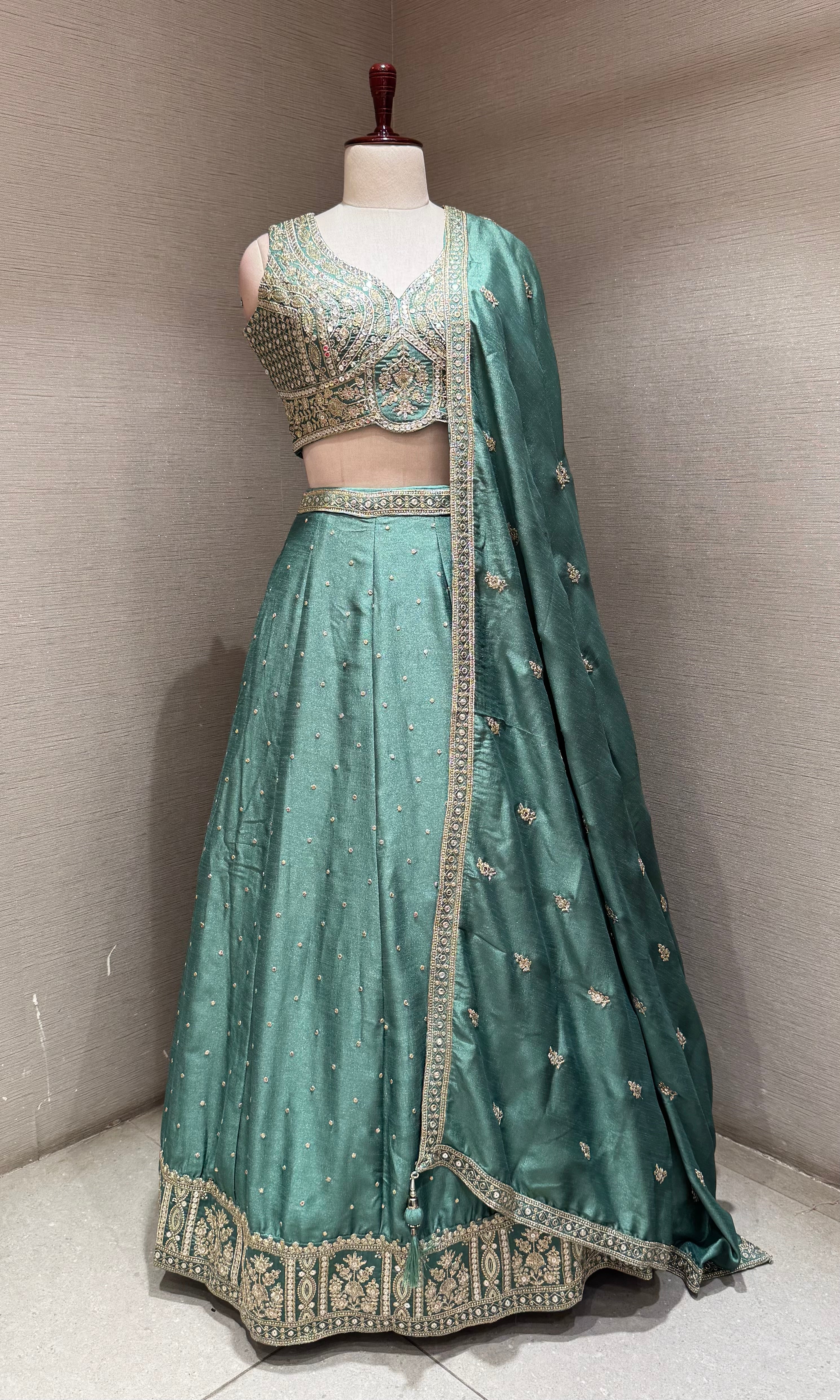 Green Flared Lehenga Choli with Heavy Gold Embroidery