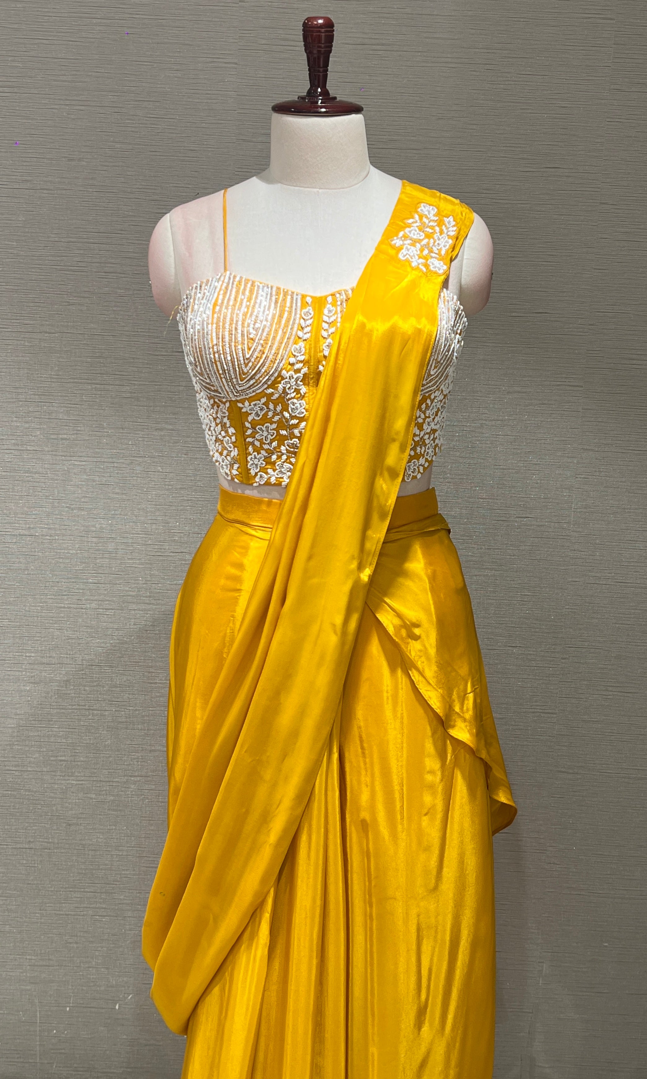 Yellow drape saree with Corset blouse