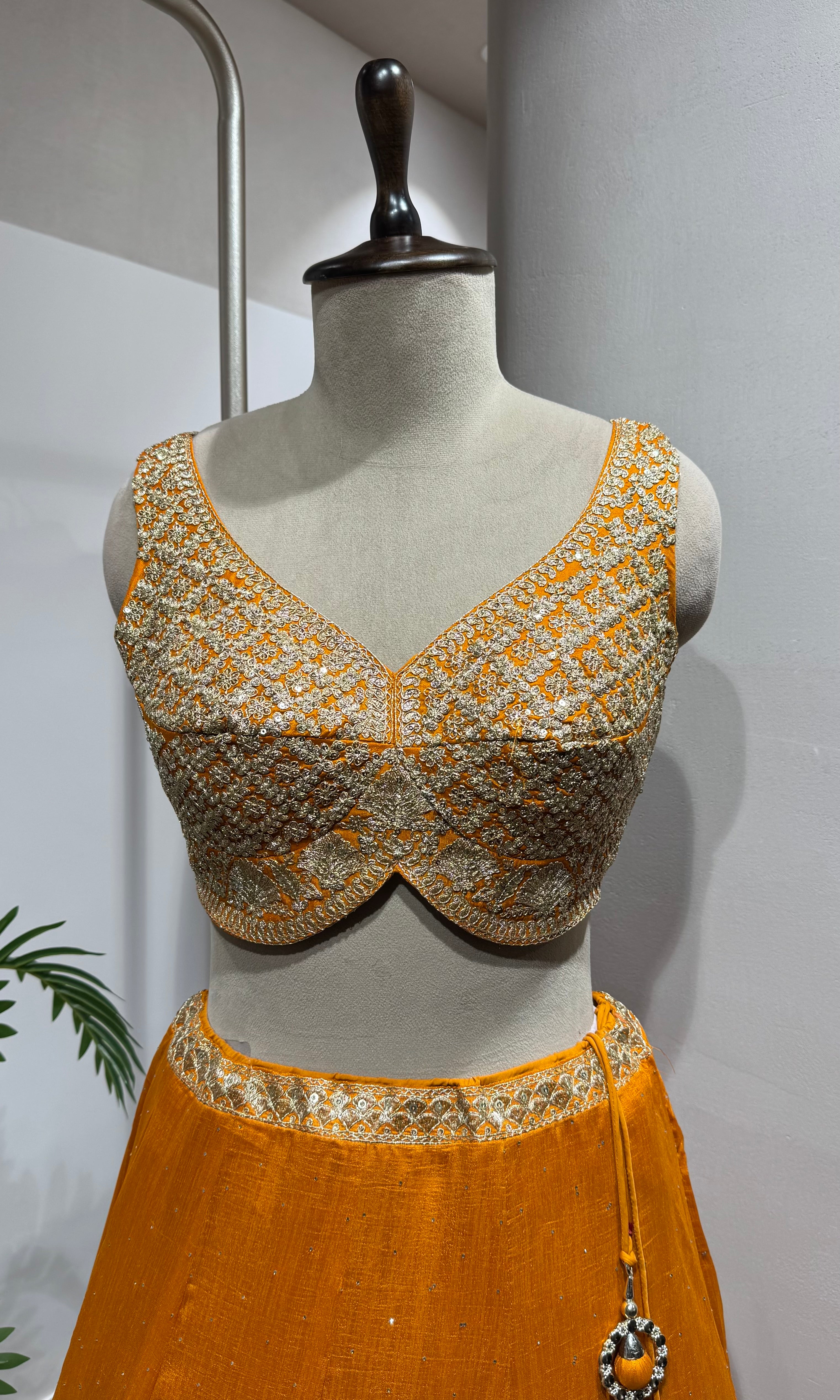 orange silk lehenga set with gold embroidery