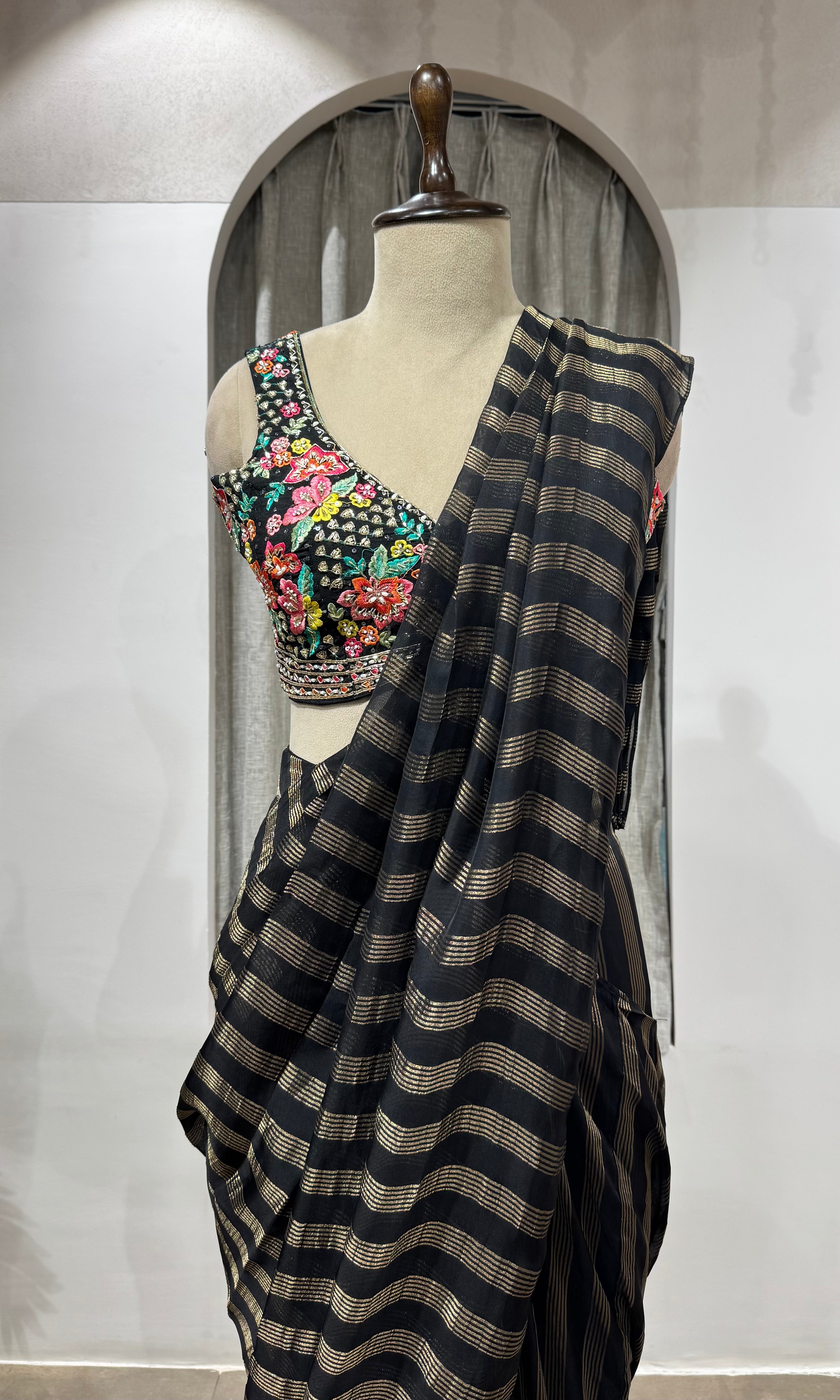 Black and silver striped drape saree with intricate blouse