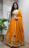 orange silk lehenga set with gold embroidery