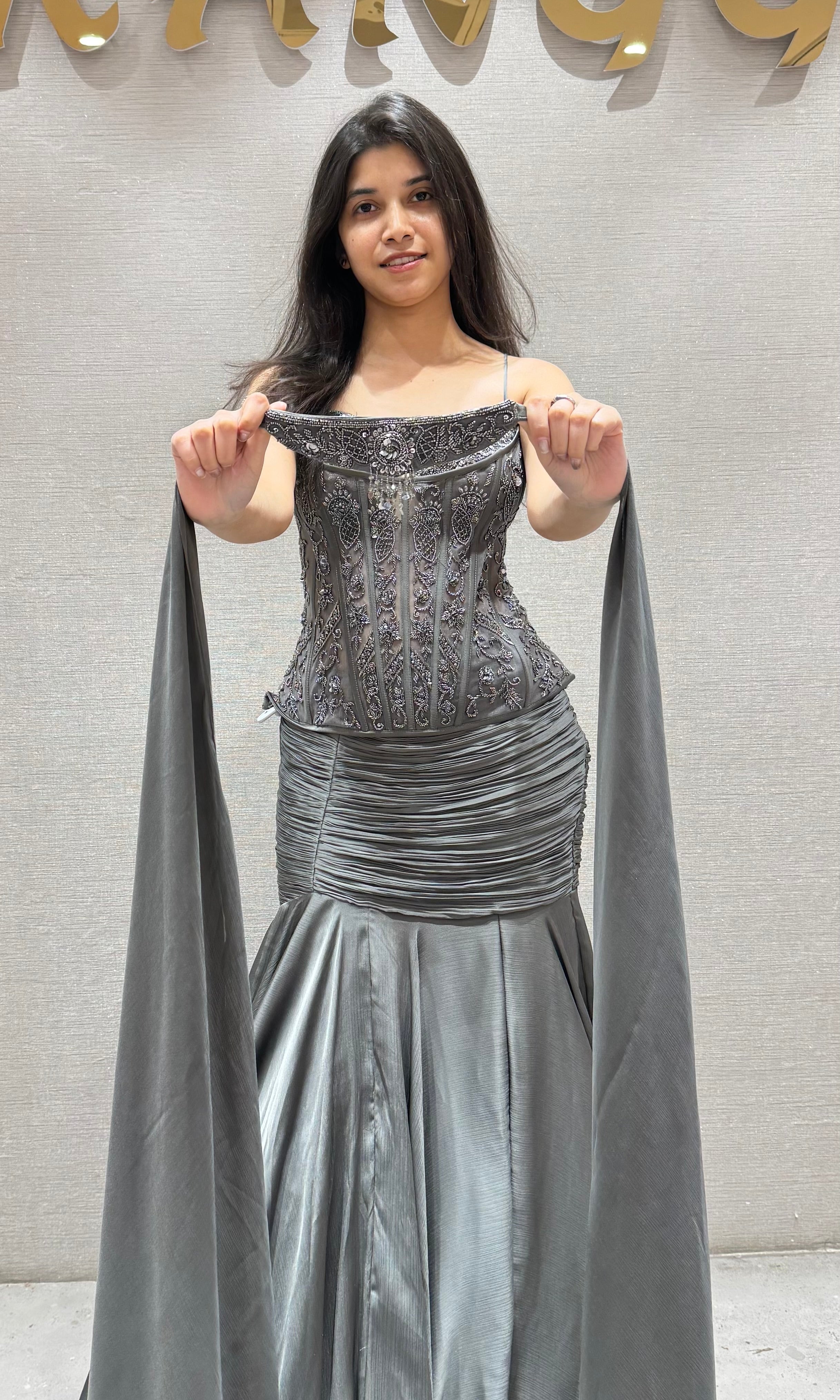 Grey ruffled lehenga with corset blouse