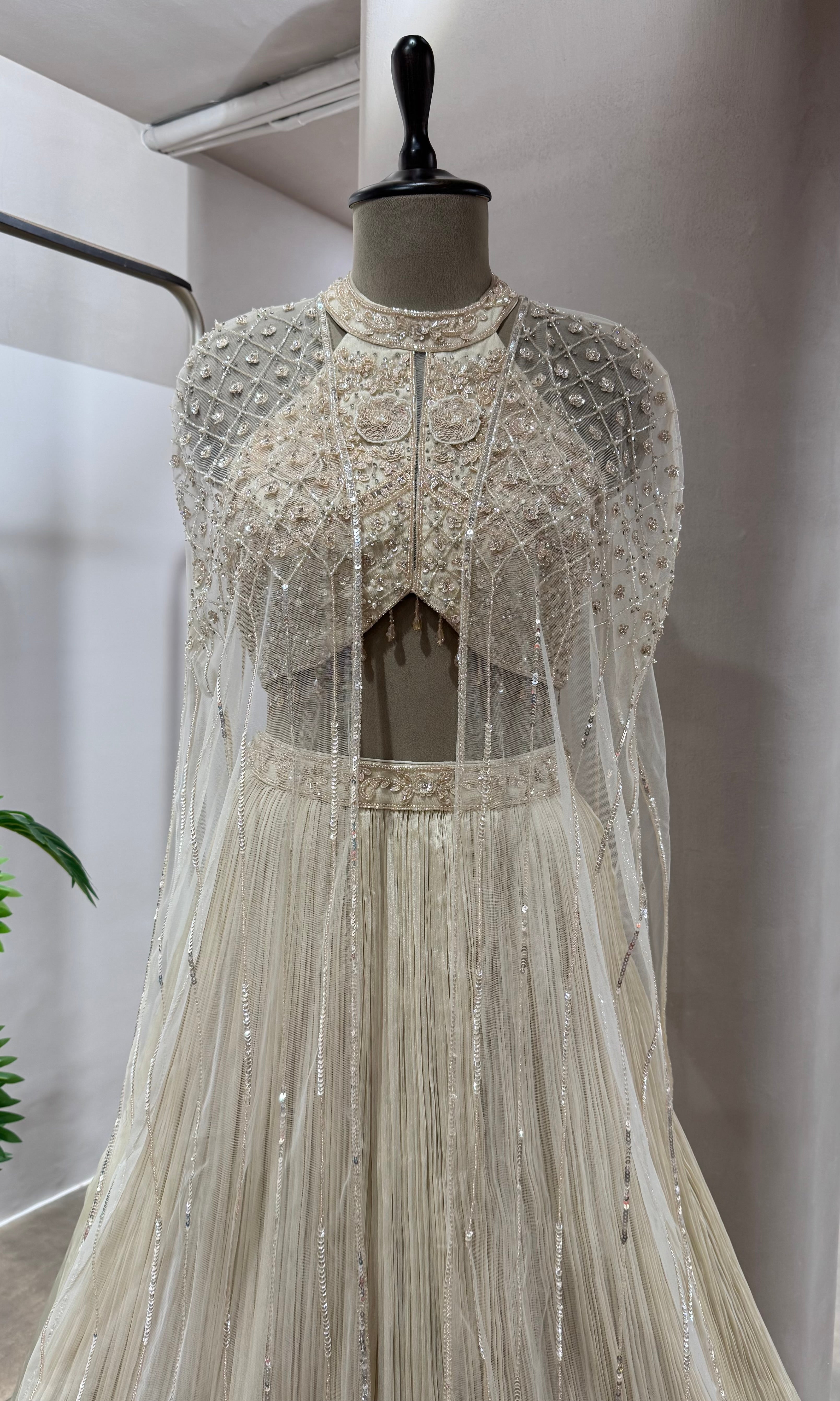 CREAM HALTER NECK CRYSTAL WORK BLOUSE WITH CAPE