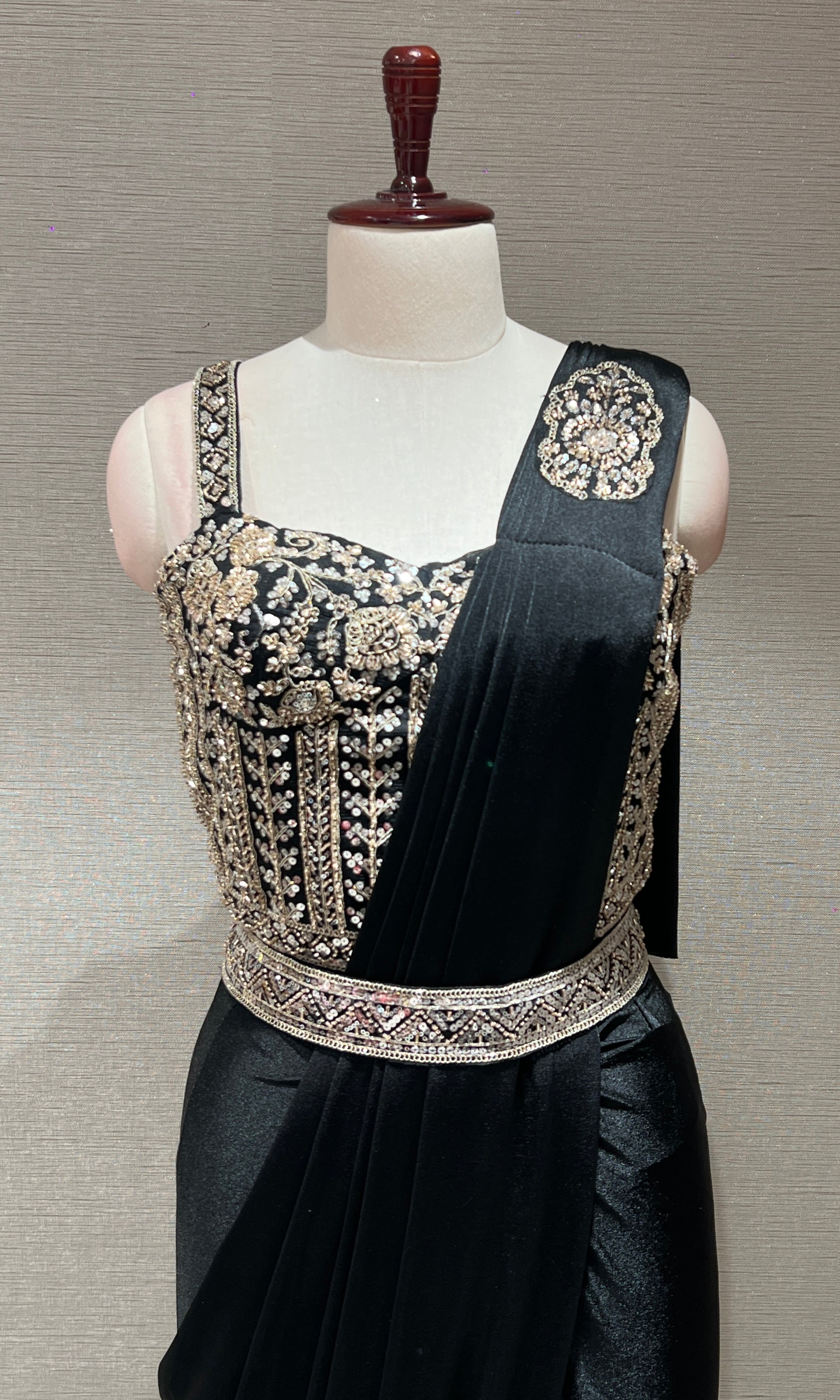 black drape saree with corset blouse and belt