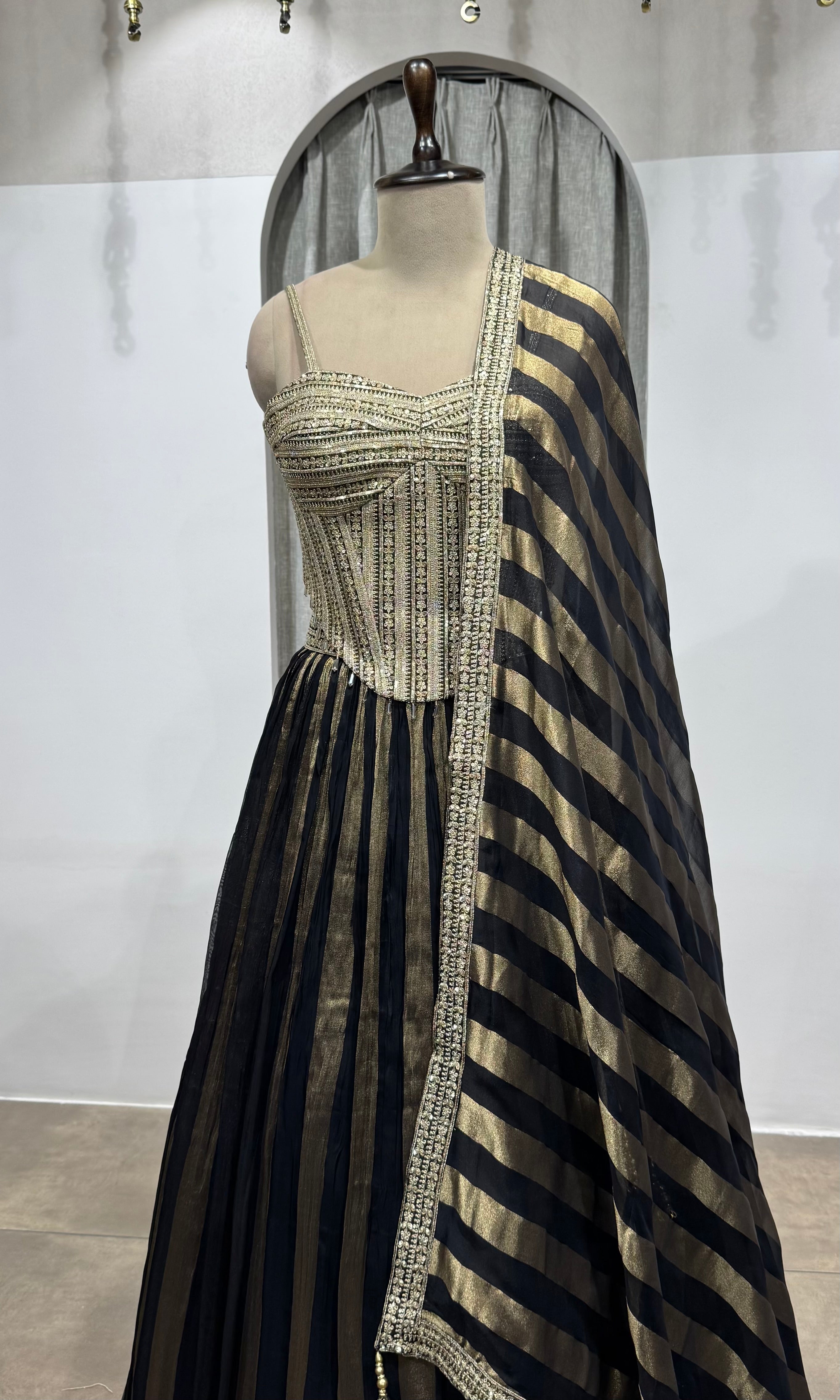 black and gold striped corset lehenga