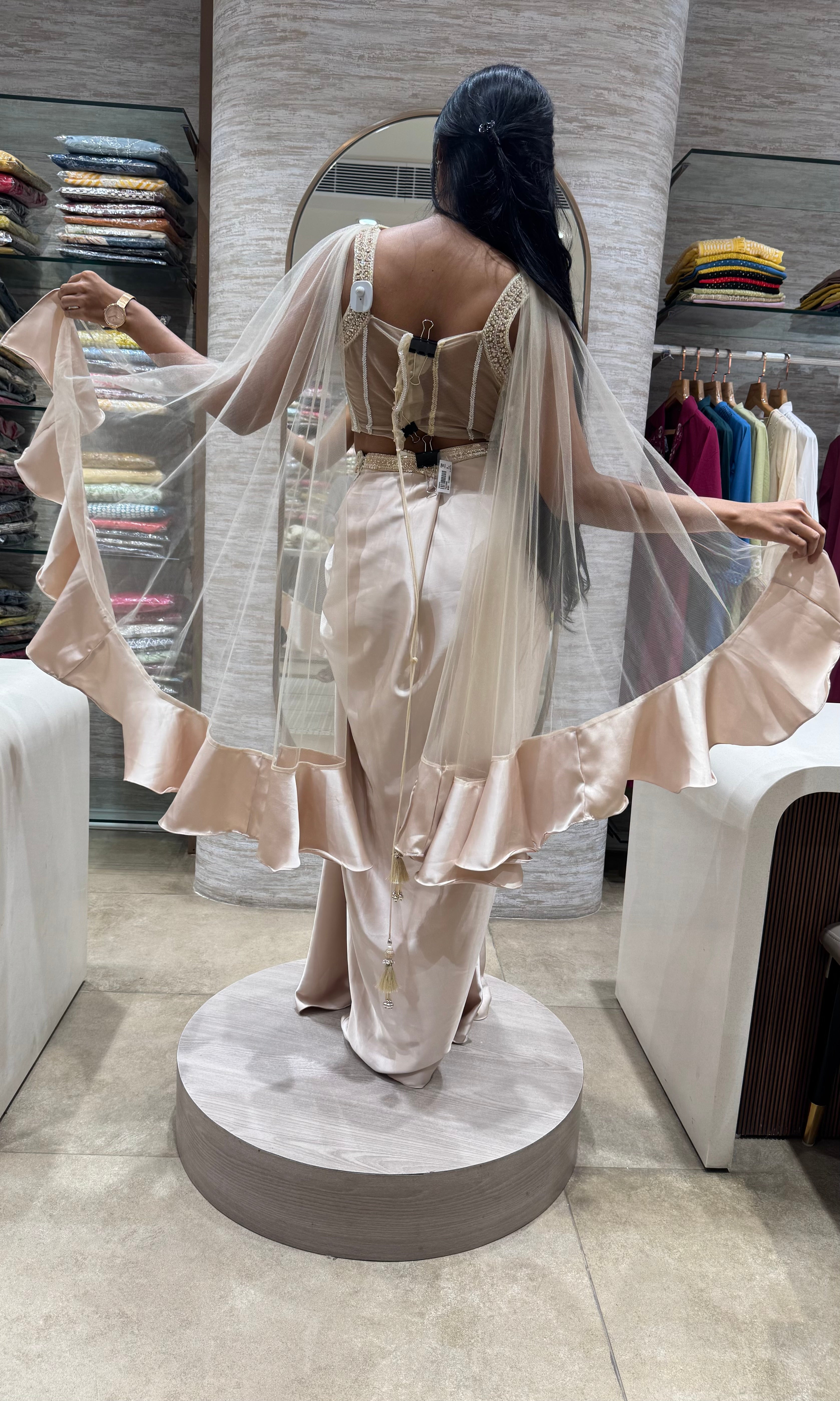 half white drape saree with corset blouse and cape