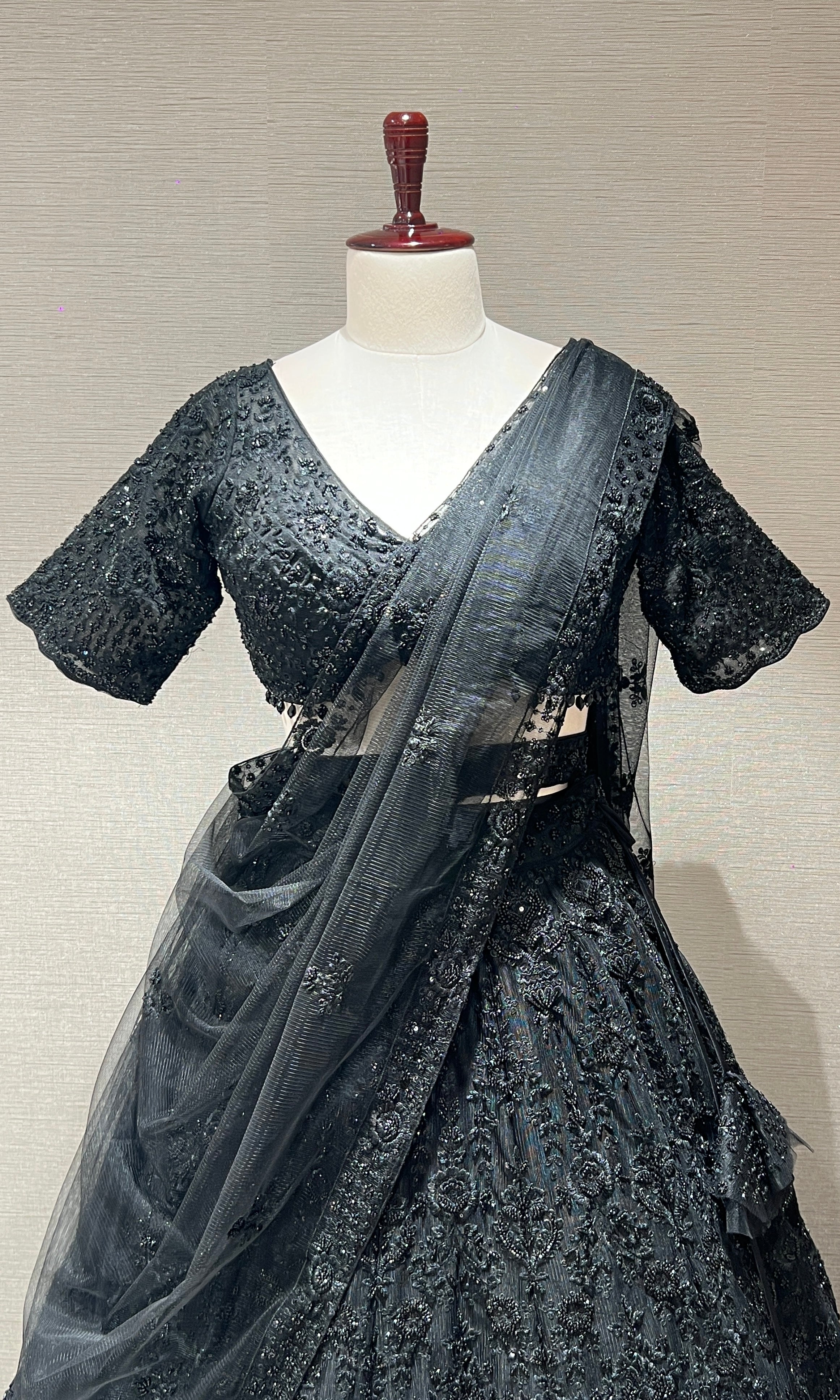 Black lehenga with pretty blouse and netted dupatta