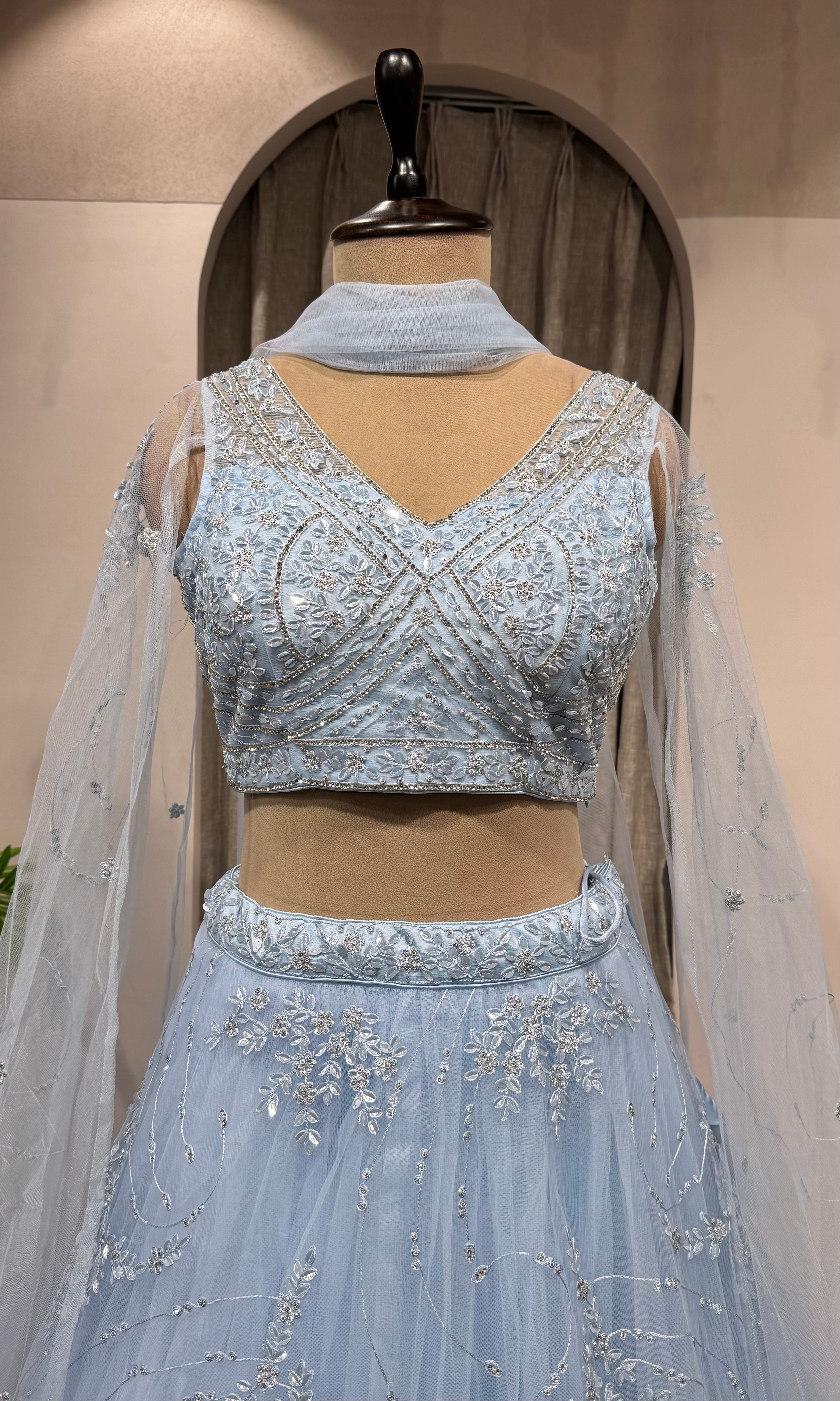 blue floral embroidered netted crop top lehenga