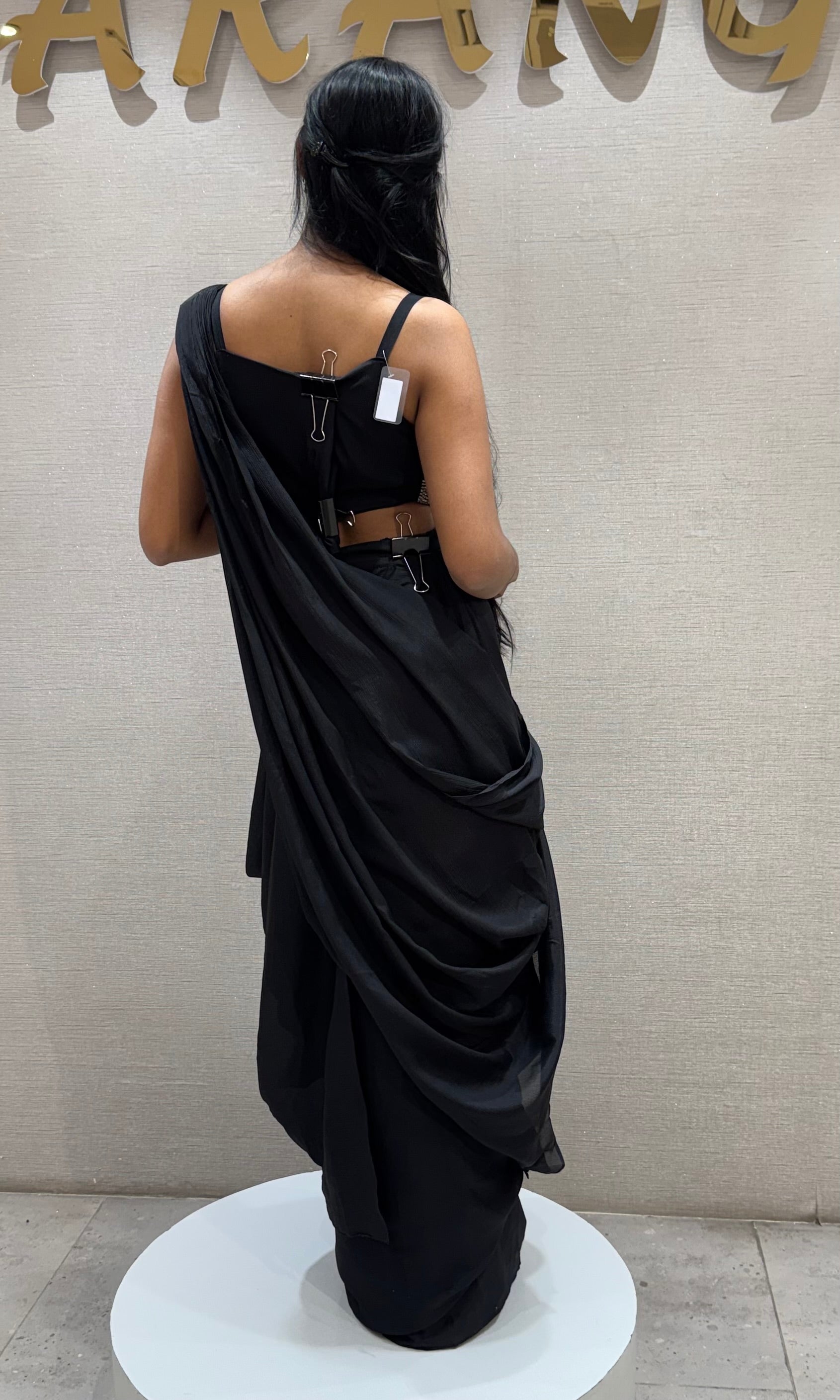 black draped saree with sequined corset blouse