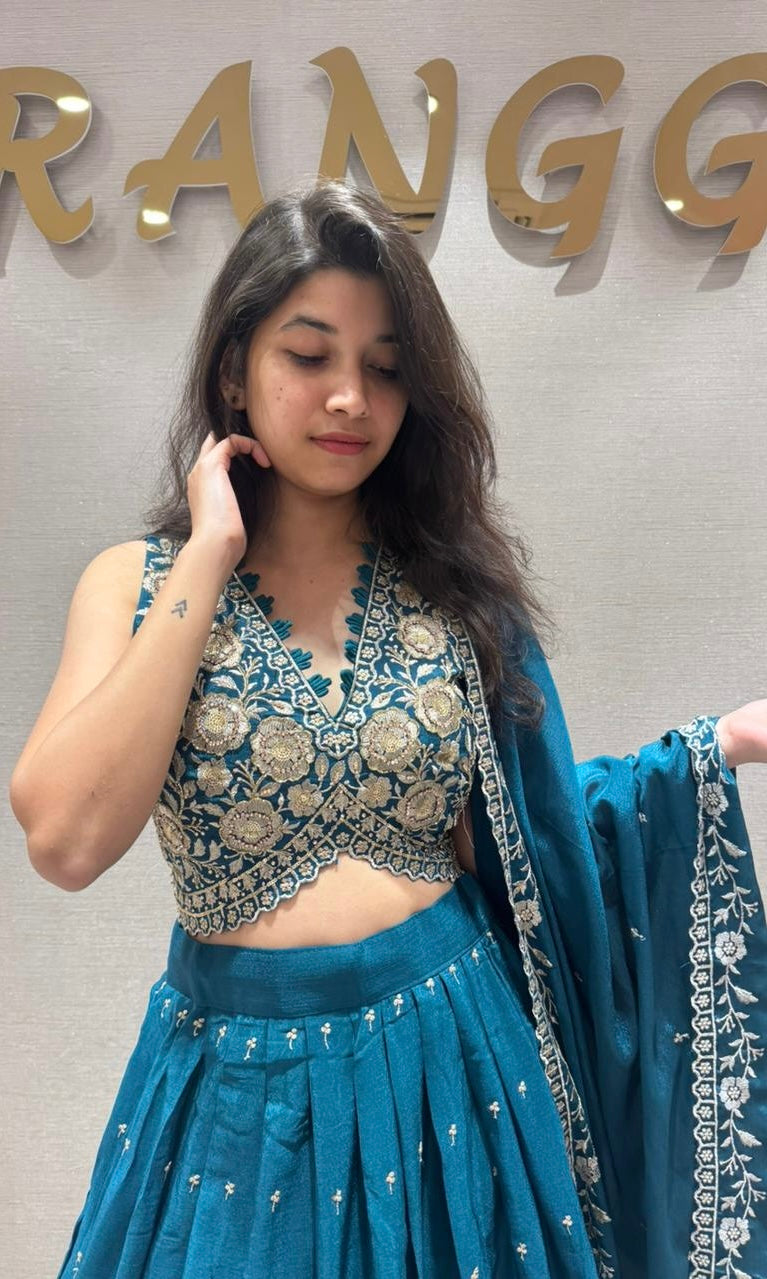 Peacock blue Lehenga with gold embroidery