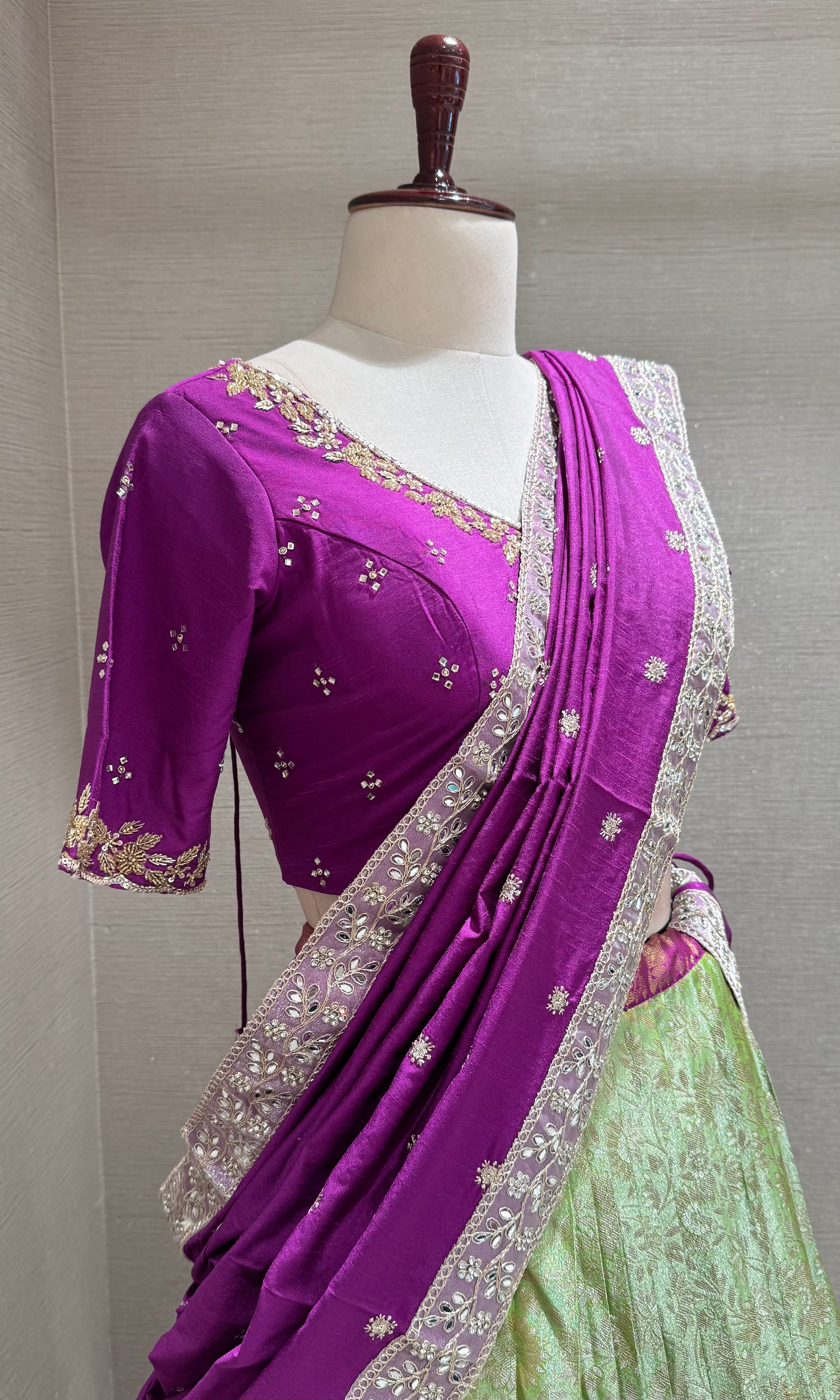 Purple and green banarasi pattu lehenga with embroidered blouse
