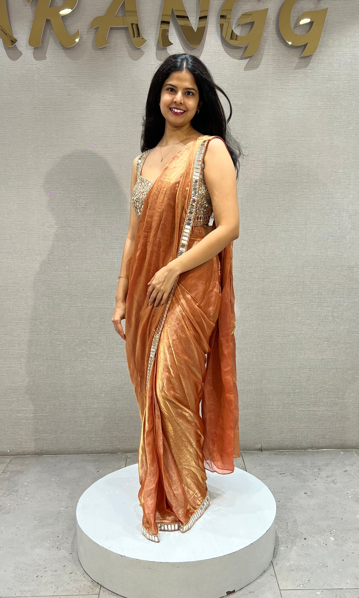 Rust Shimmer Drape Saree with mirror embellished blouse