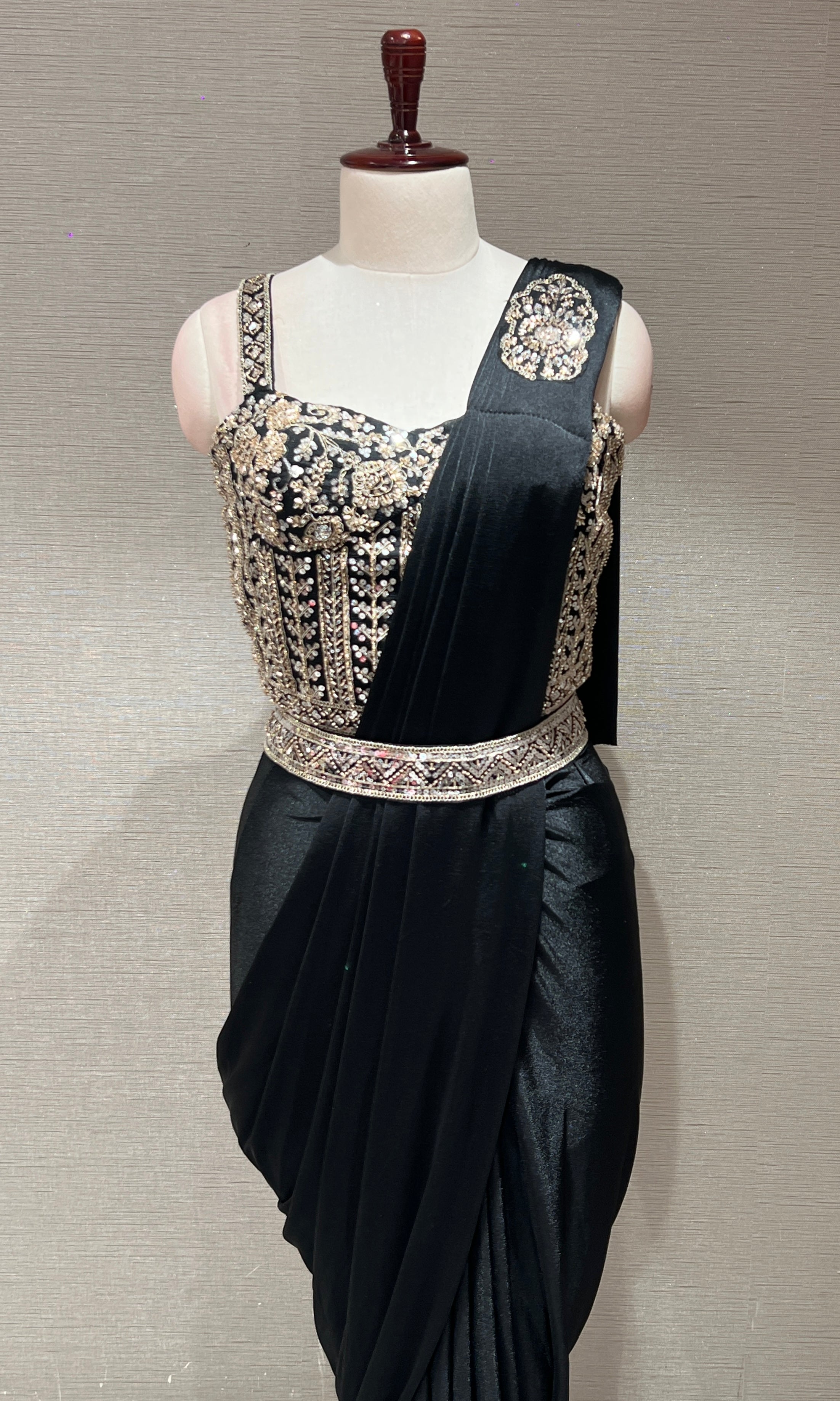 black drape saree with corset blouse and belt