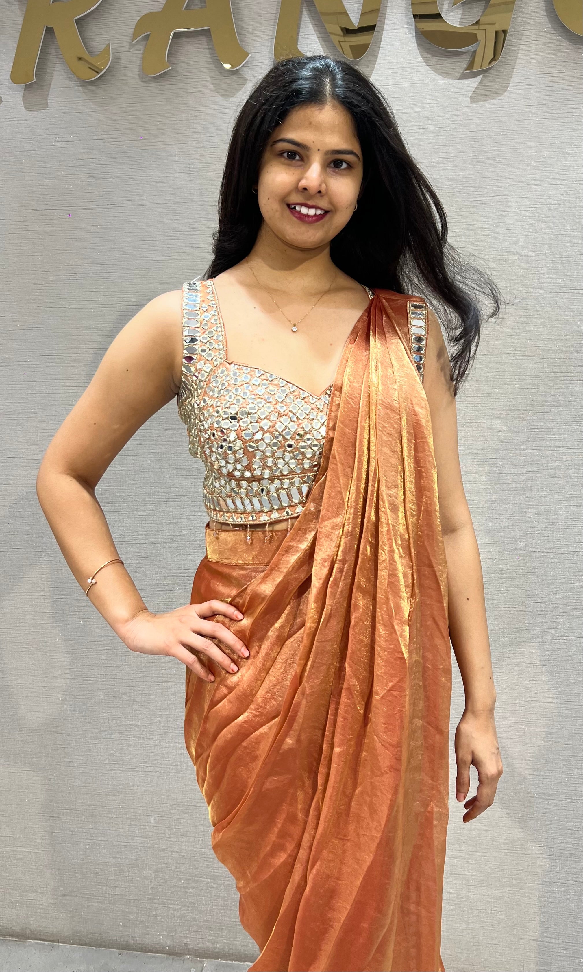 Rust Shimmer Drape Saree with mirror embellished blouse