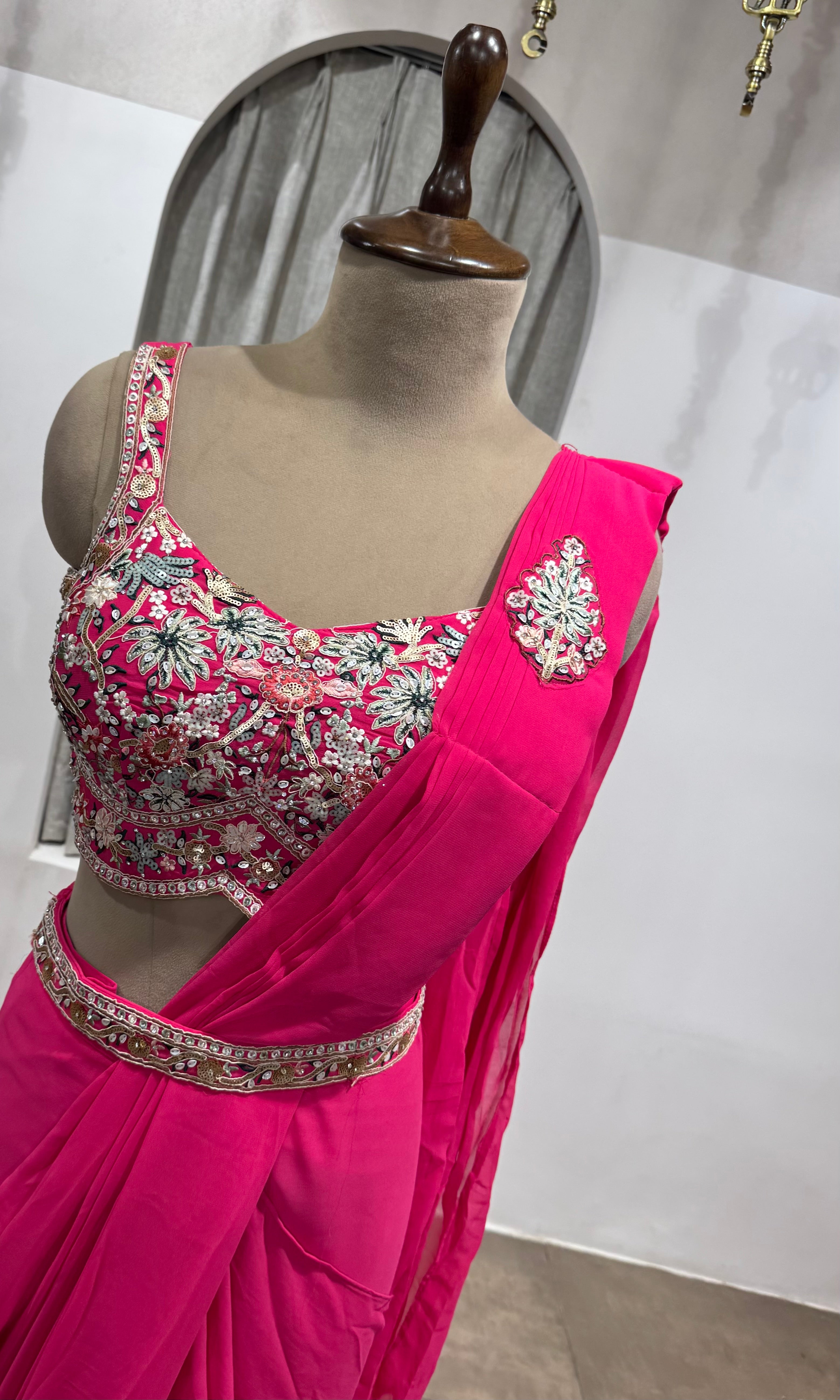 Pink drape saree with floral blouse & belt